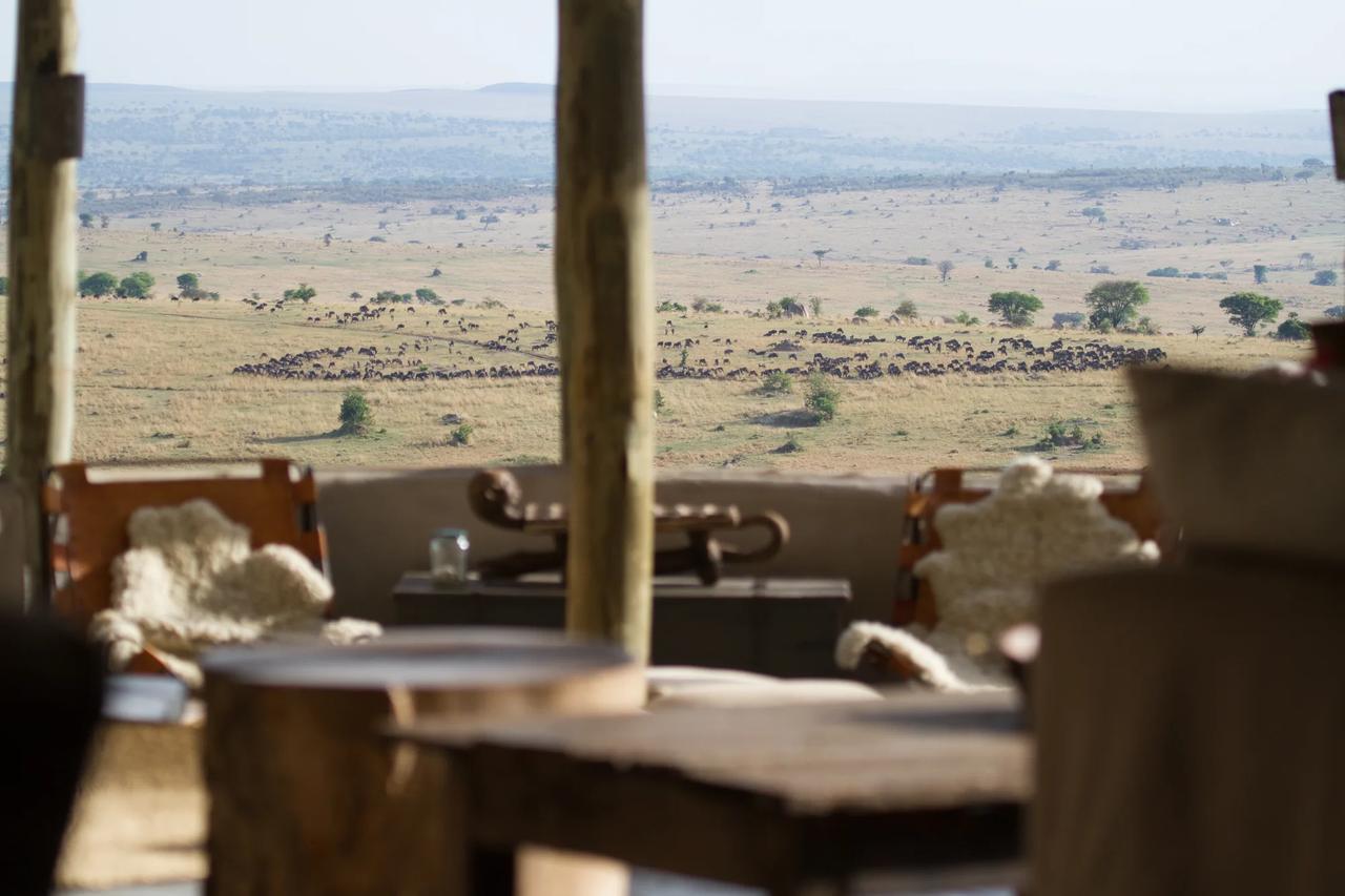 The view over open plains from inside a safari lodge