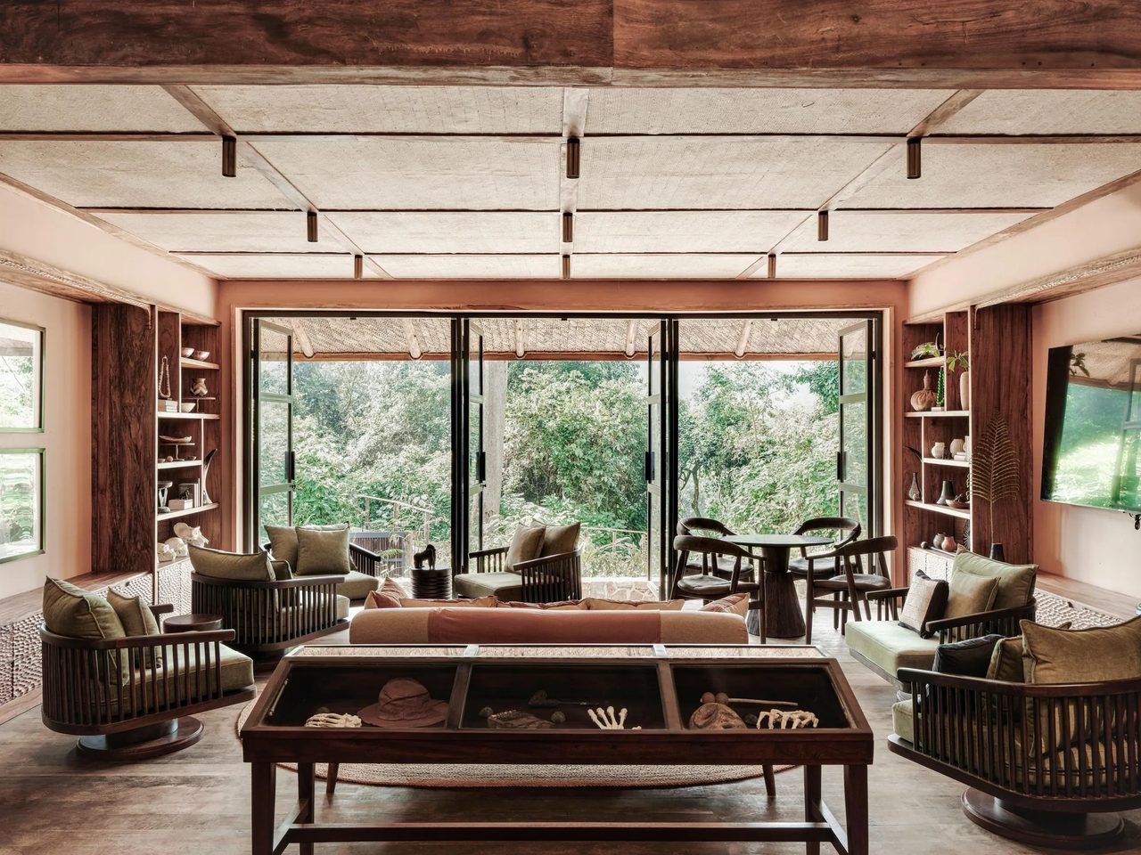 A forest lodge writing lounge with maps and books