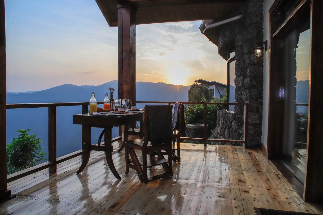 Sunrise reaches a breakfast table on a ridge above the forest