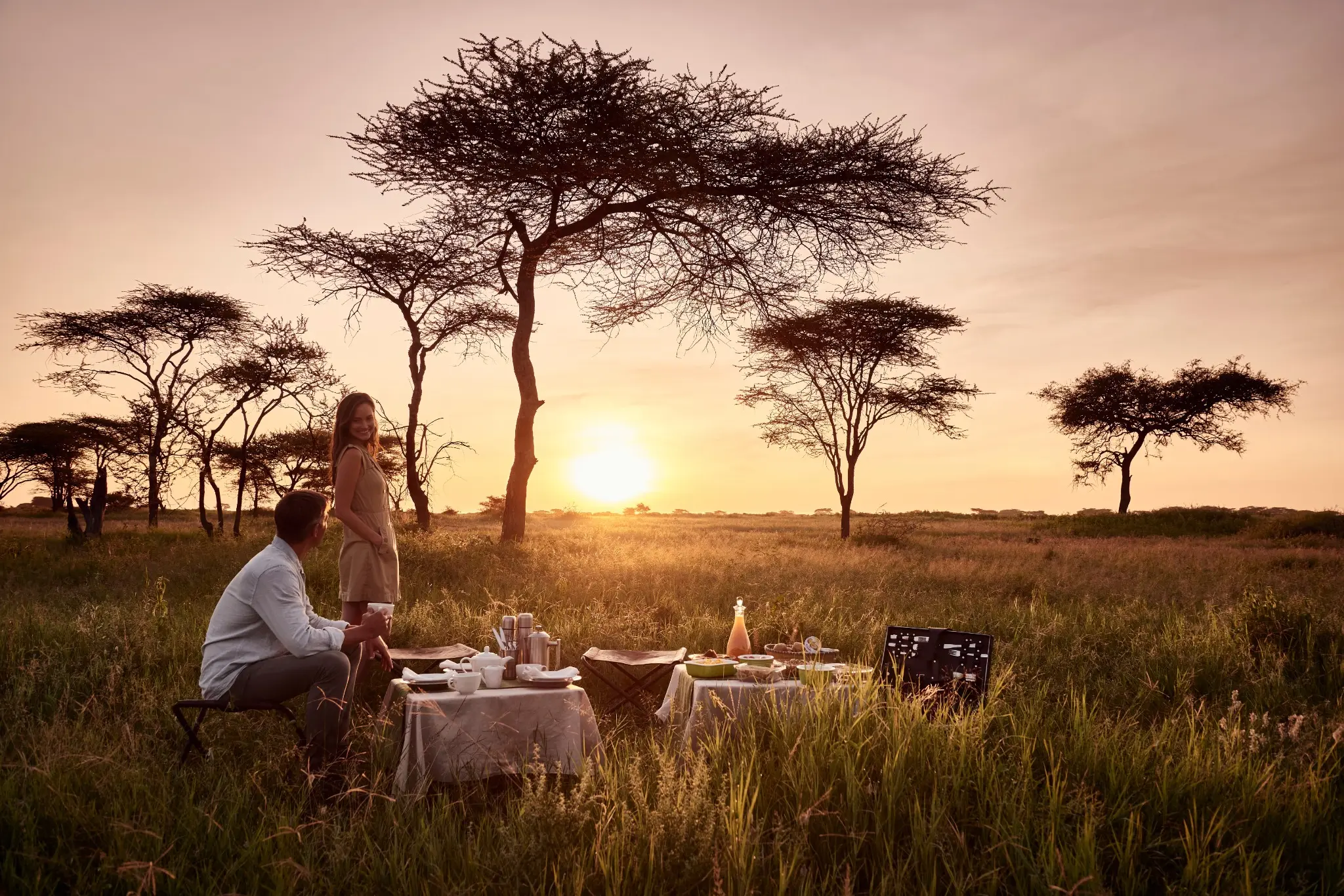 A private breakfast prepared for two in the East African wilderness at sunrise