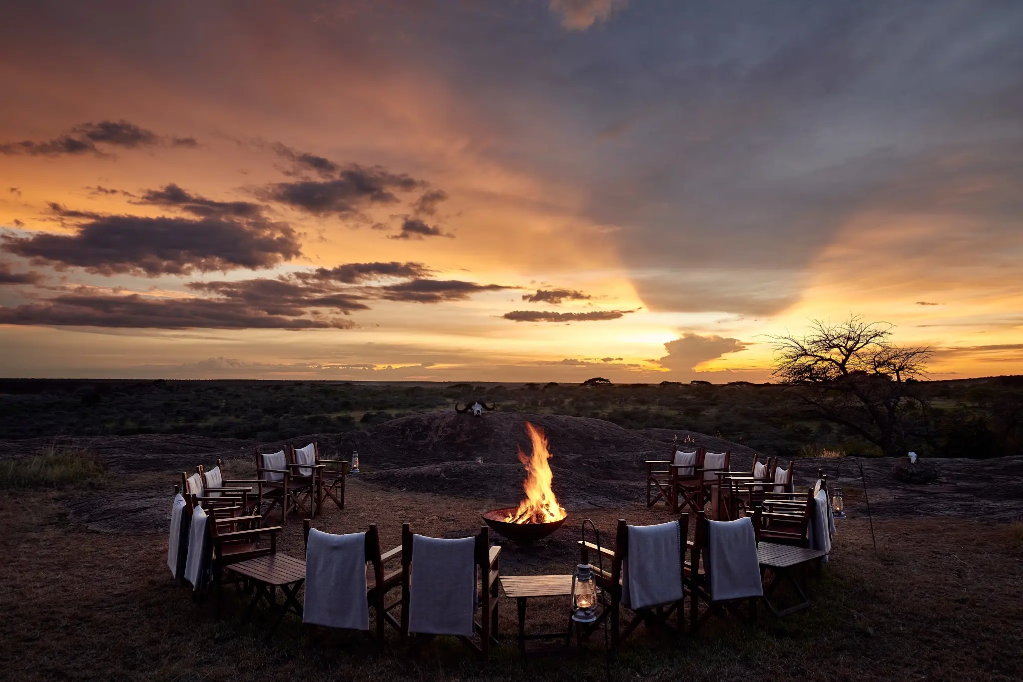 A private safari campfire prepared at sunset