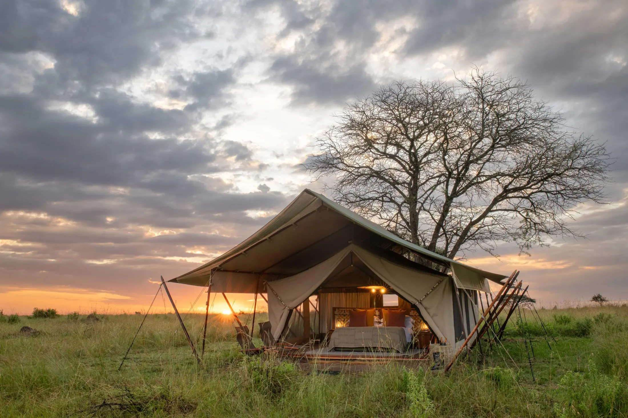 Mobile tented safari suite at sunset in the Serengeti