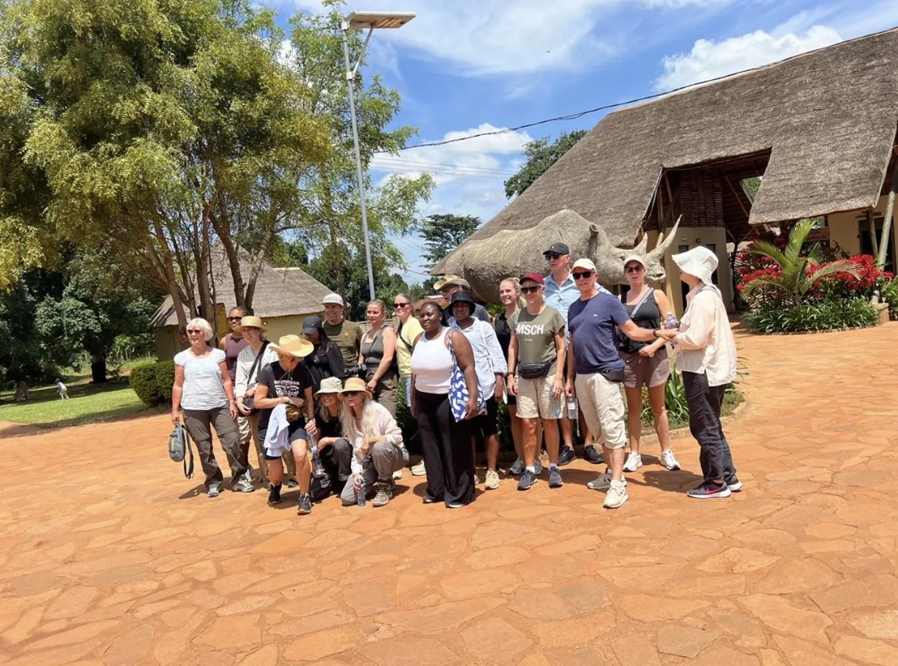 Guests gather at a community building near the forest