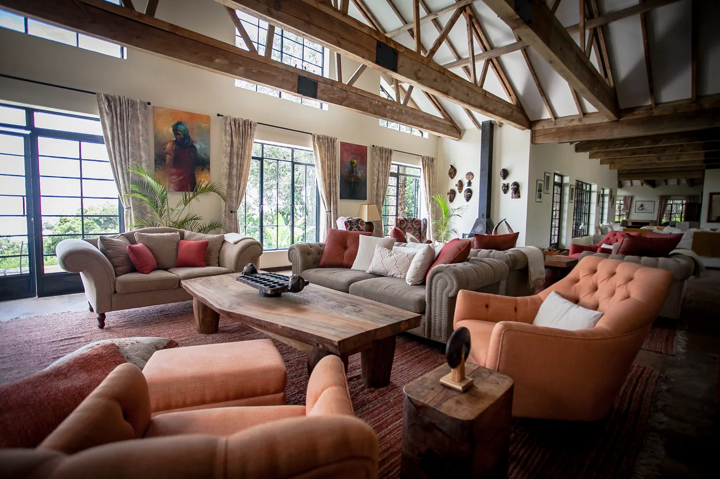 A stone-walled sitting room with deep sofas and highland light