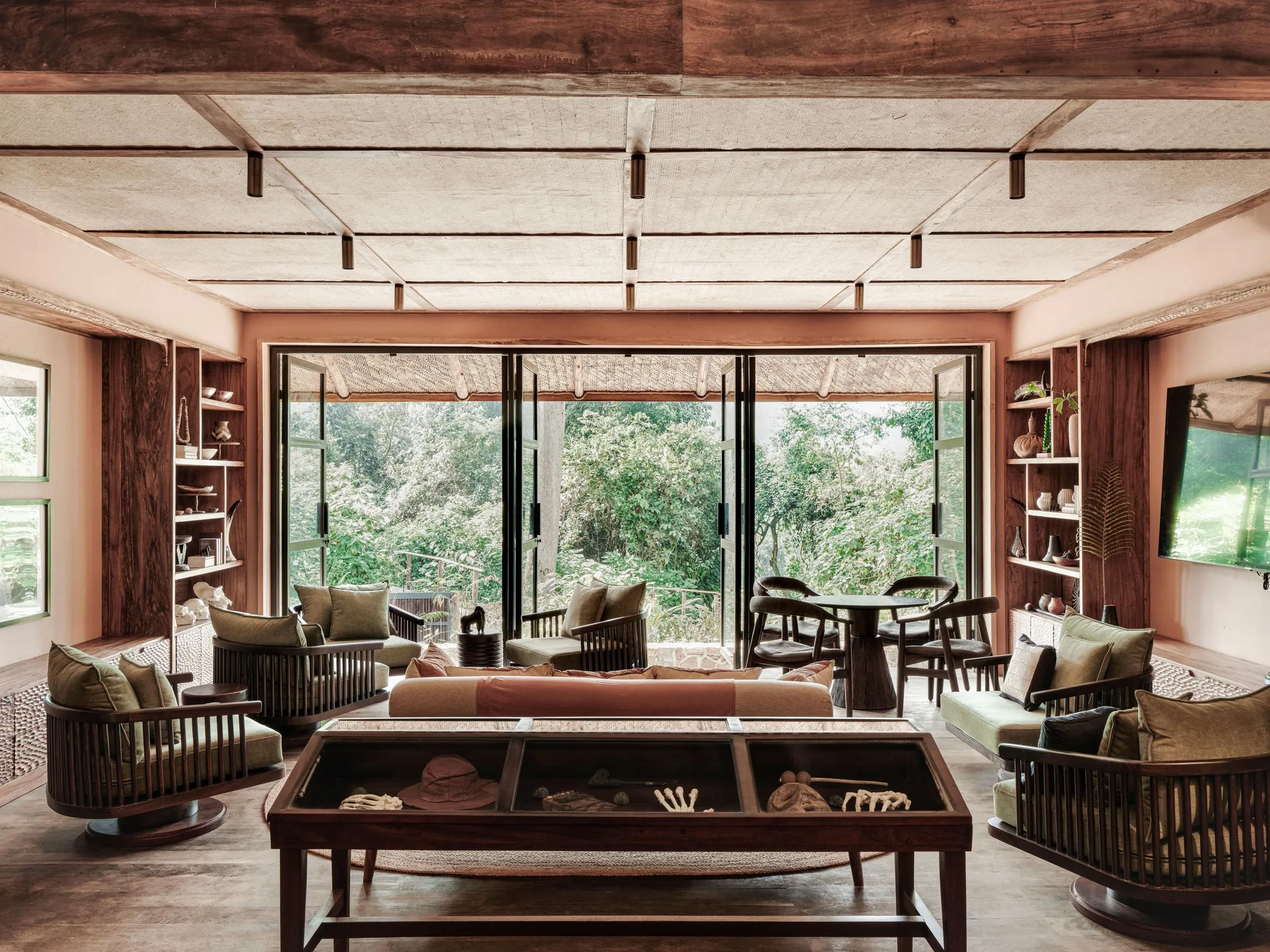 A forest lodge writing lounge with maps and books