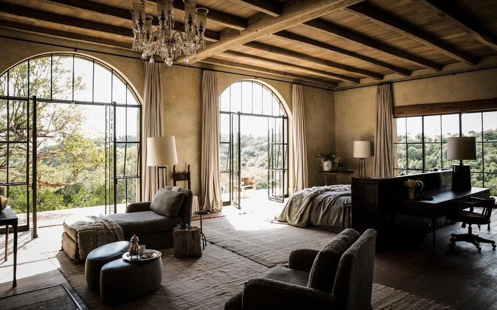 A stone-arched suite looks out over the Laikipia plateau