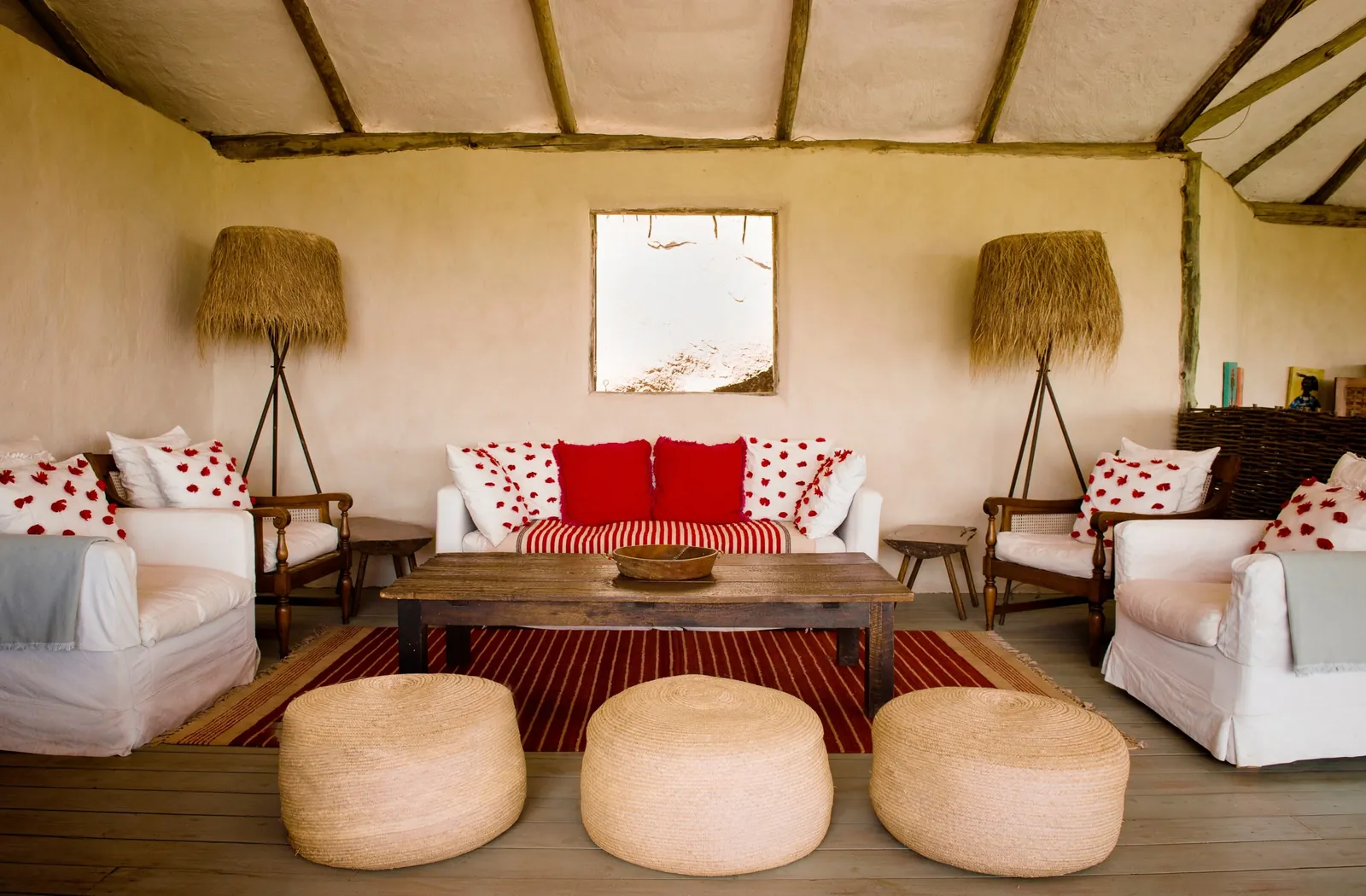 A camp lounge stands open to the light, unhurried and unoccupied