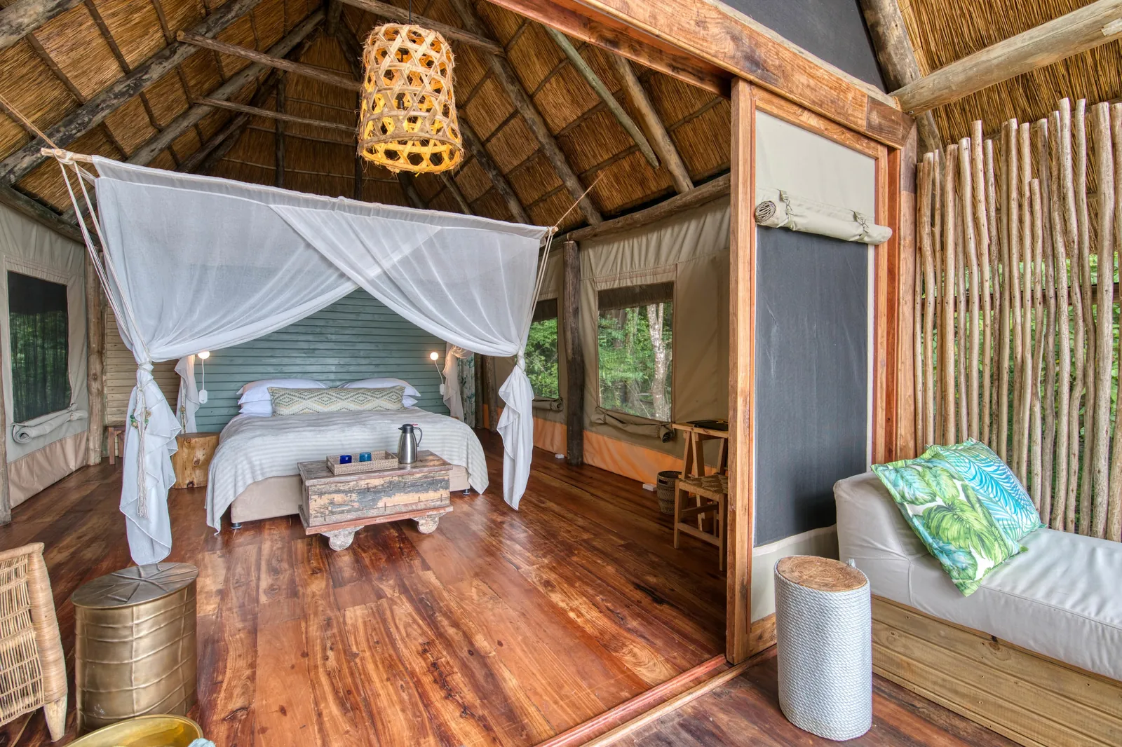 A banda bedroom looks straight out to the lake horizon