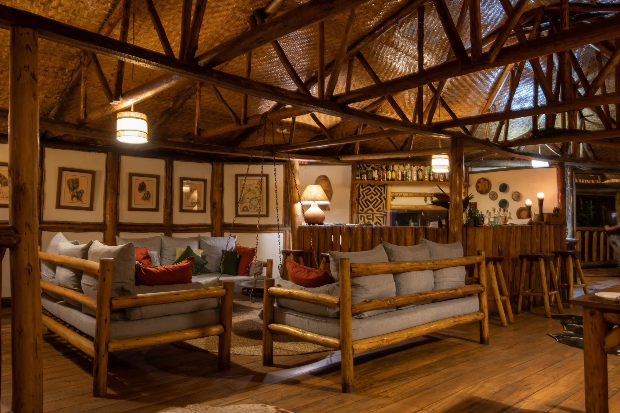 The warm timbered main room of a forest lodge