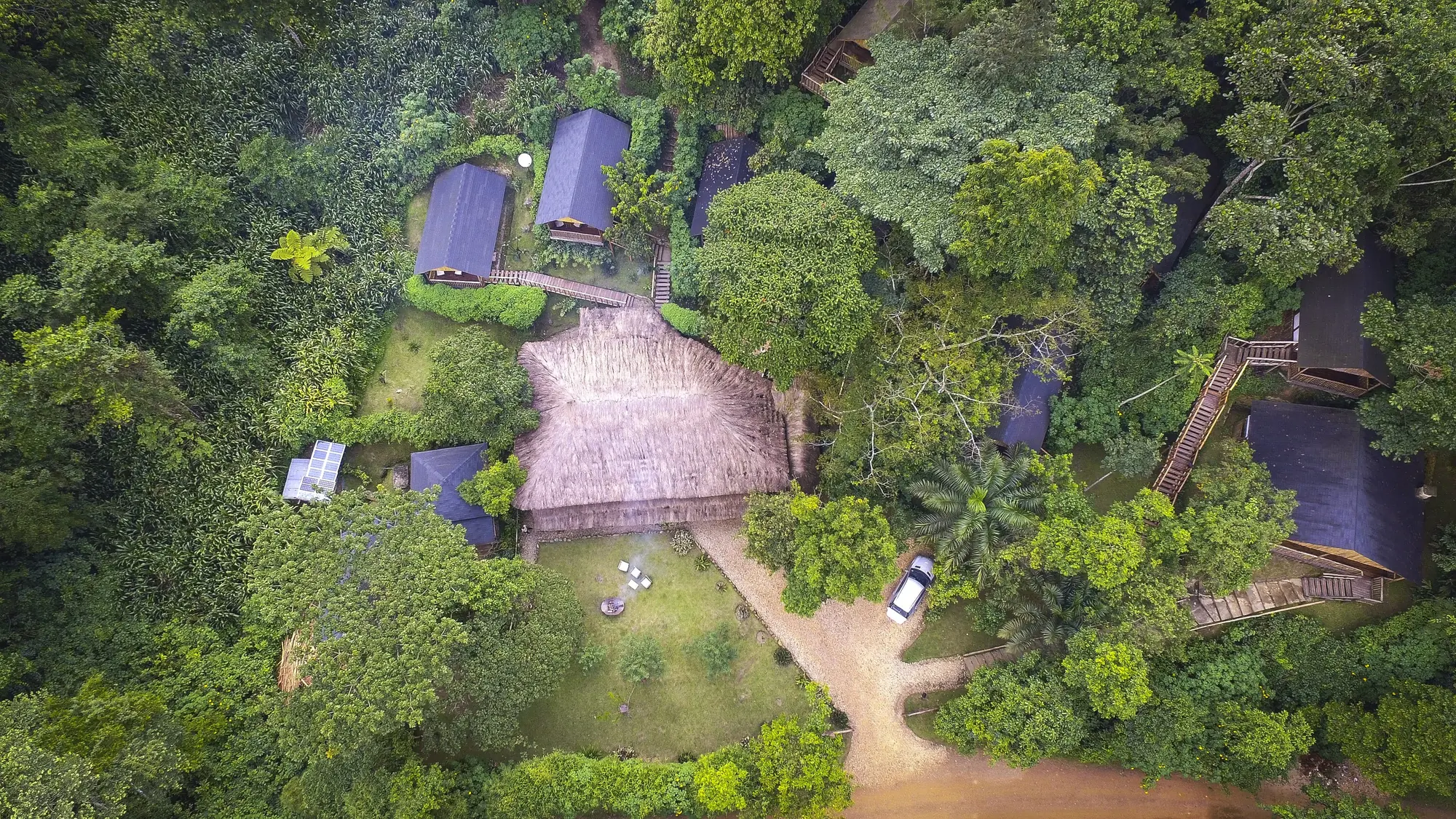 A forest lodge clearing sits deep in Bwindi seen from above