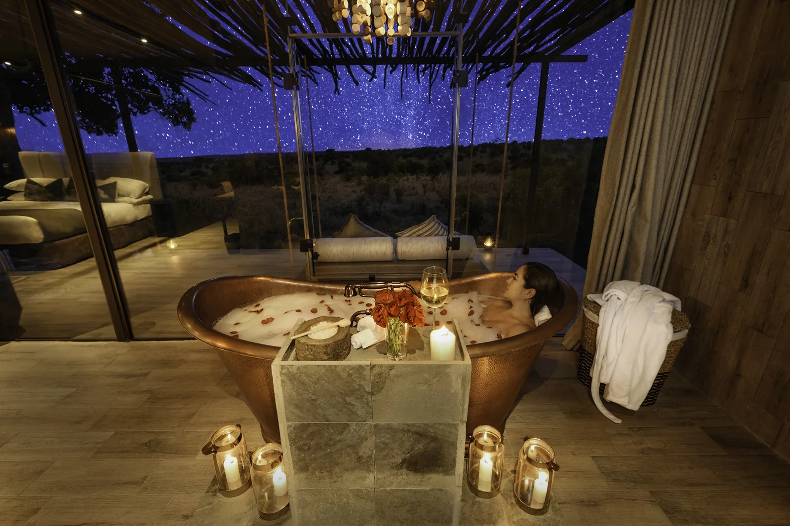 A candlelit bath waits beneath the stars