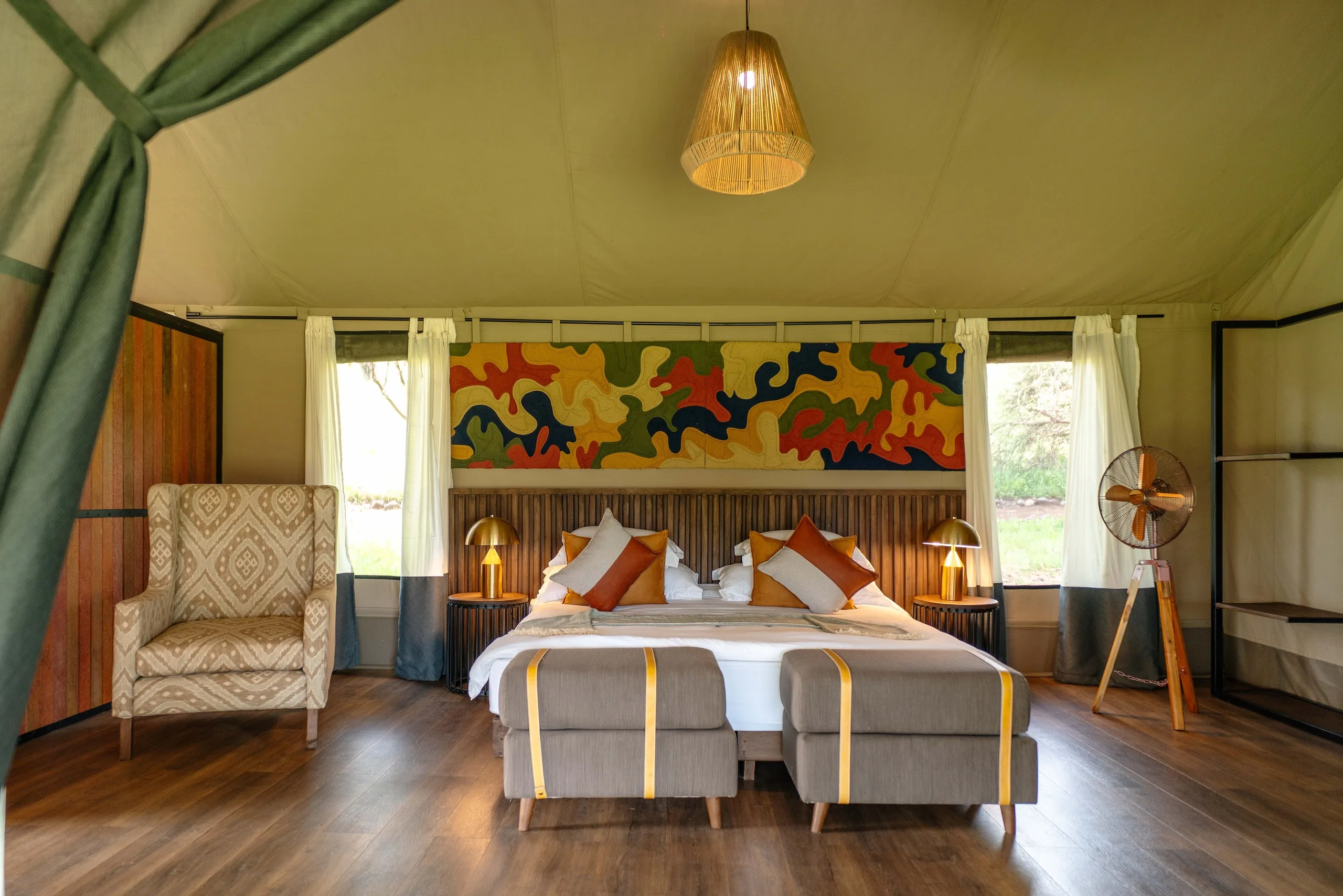 A tented suite stands ready under canvas in the Serengeti