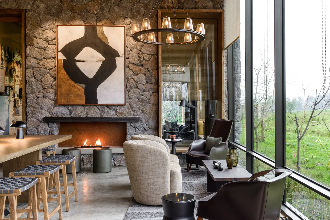A lodge lounge opens toward the volcanoes