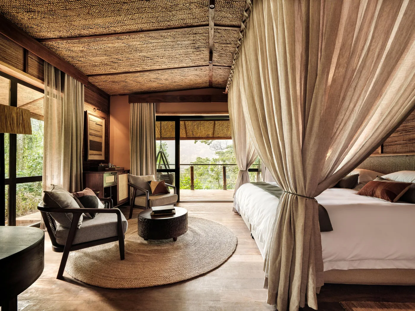 A forest-lodge bedroom, calm the night before the trek