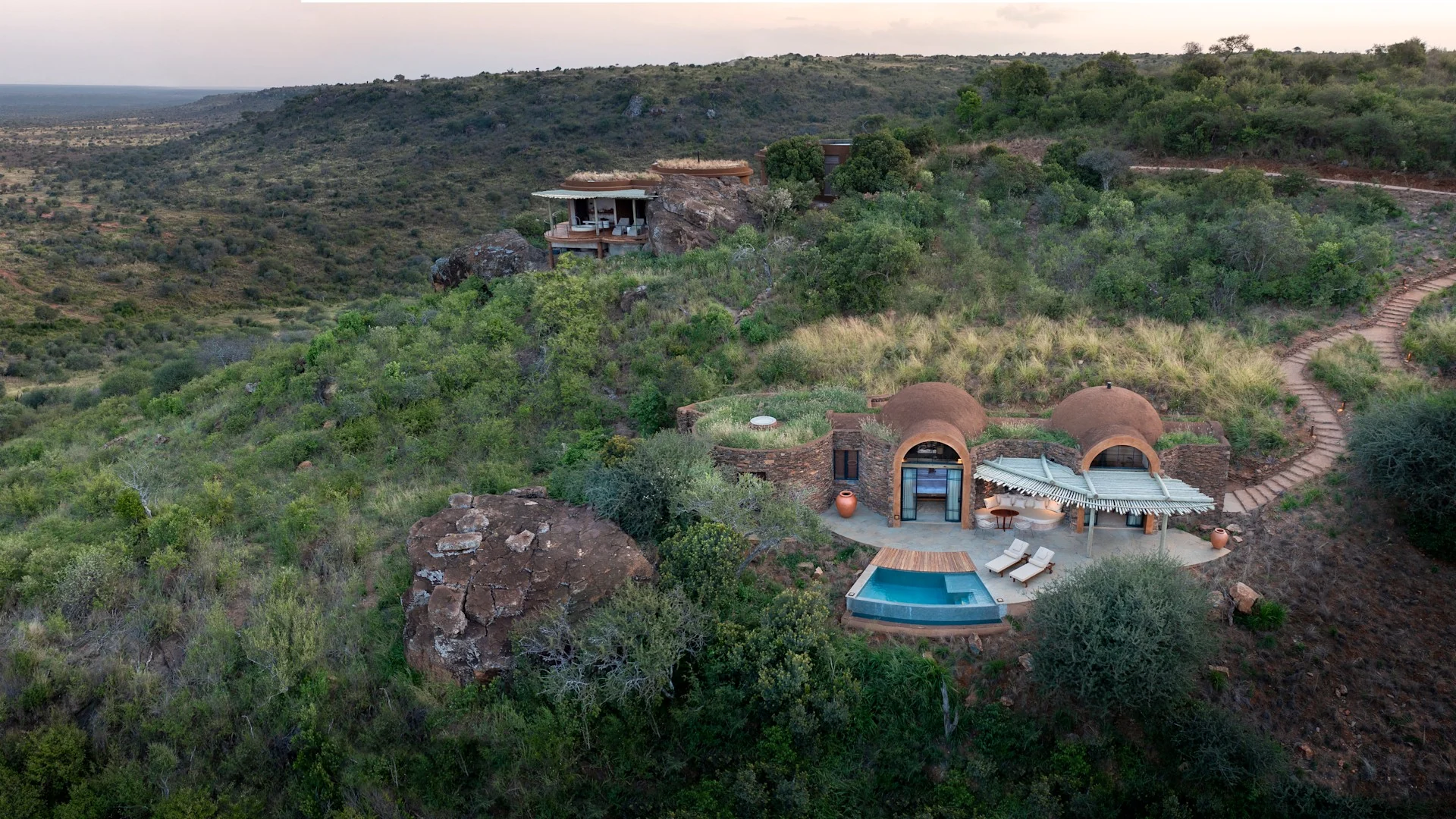 The lodge and its pool from the air