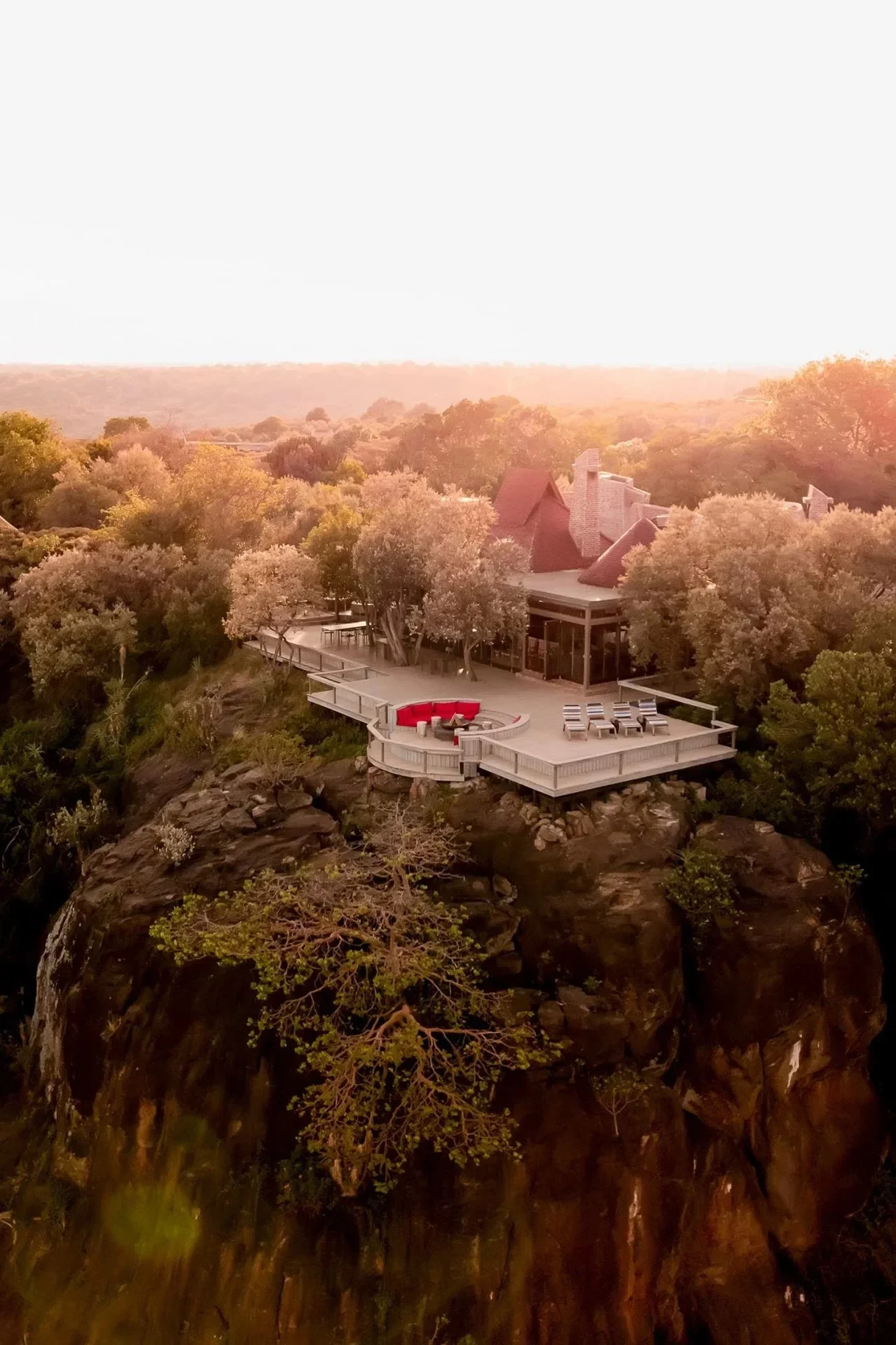 The lodge on its wooded ridge from the air