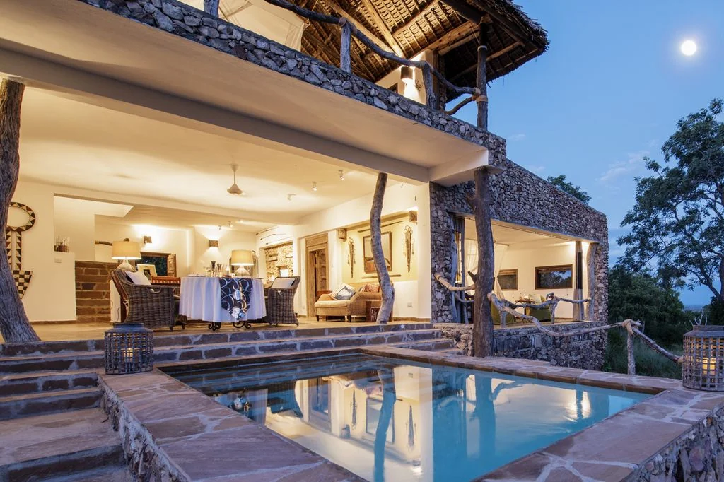 The main house and pool in the evening