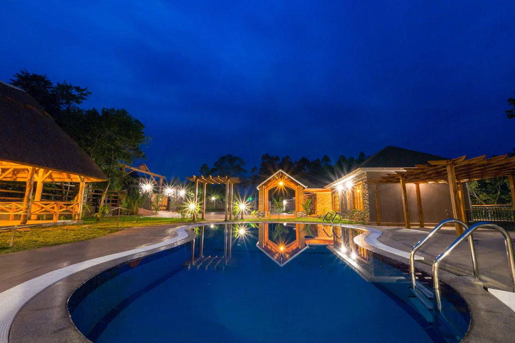 The pool and main building lit at night