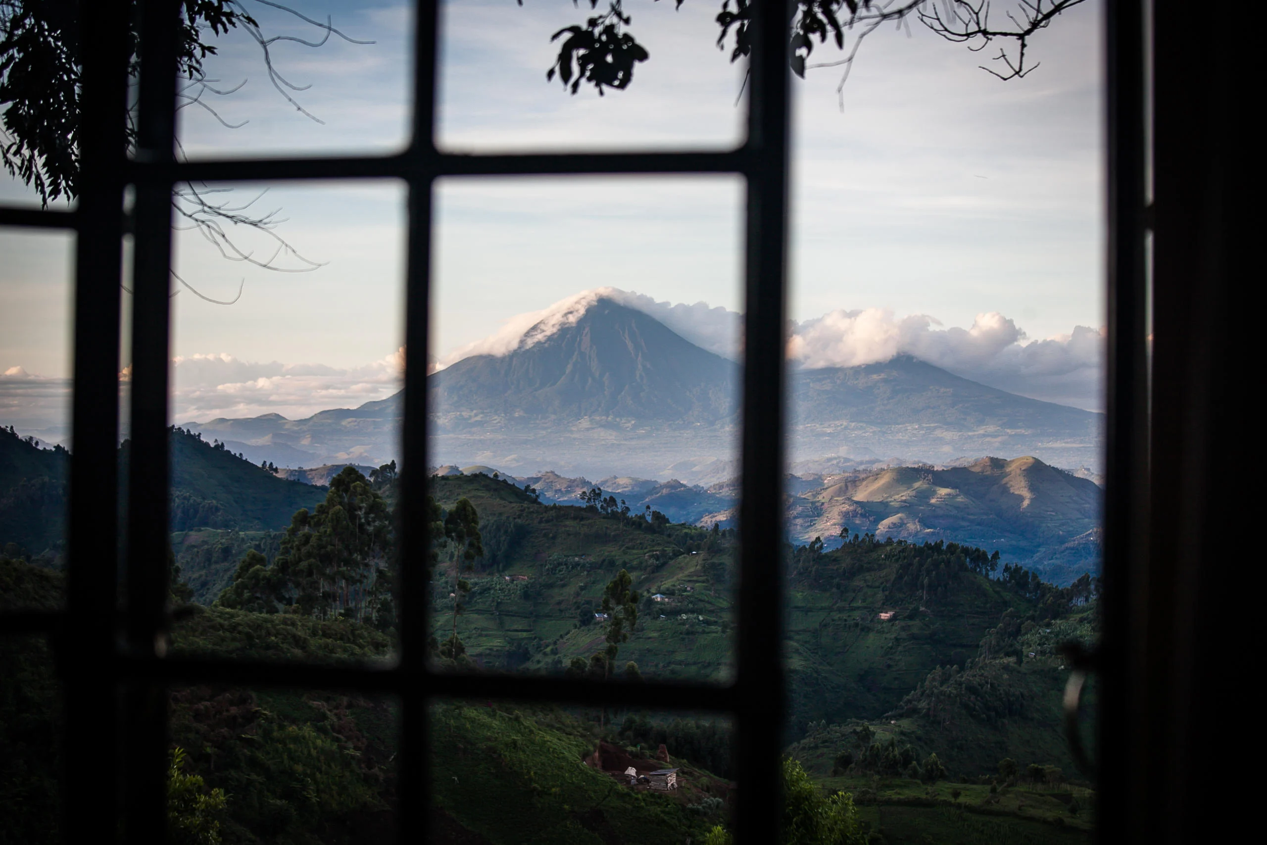 A volcano seen through the lodge window