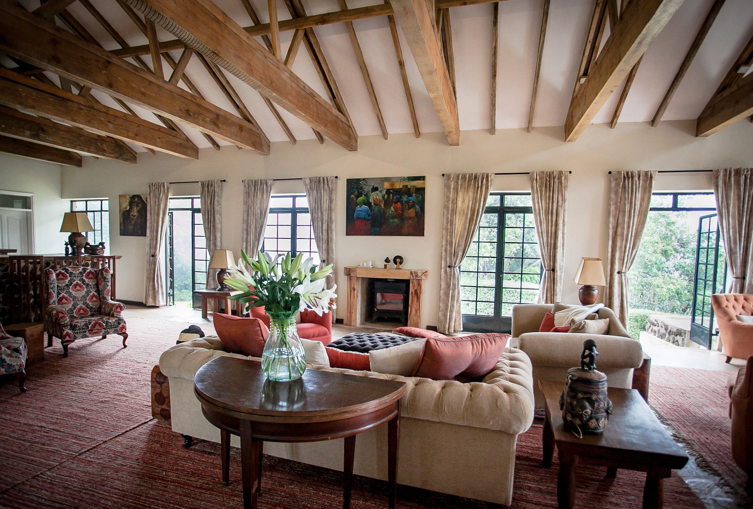 The lounge with a fireplace and flowers on the table