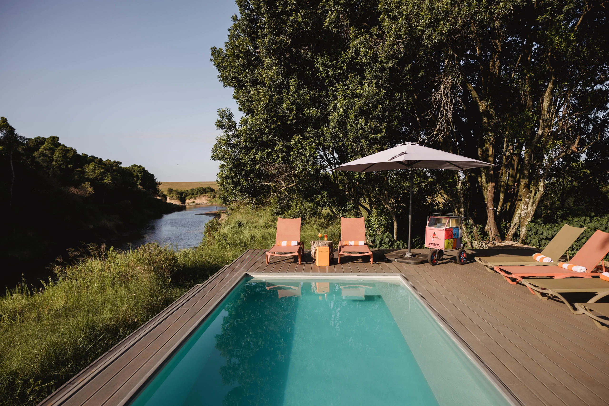 The pool beneath the trees above the river