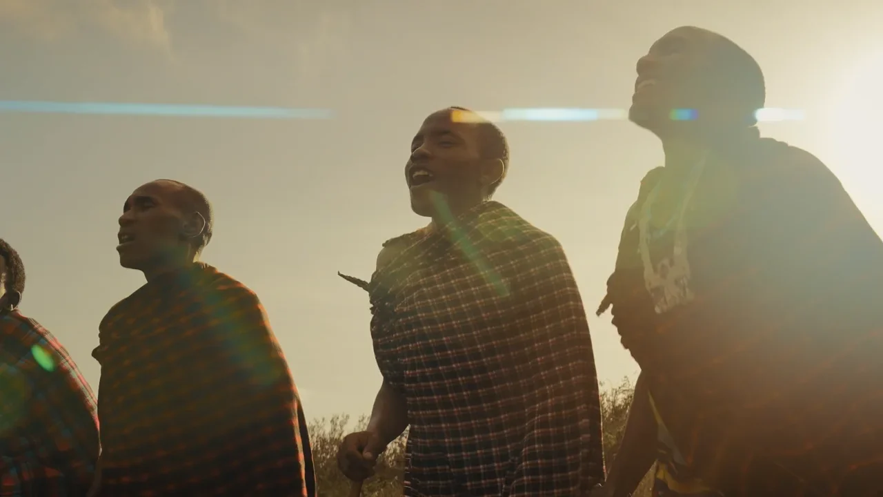 Maasai men walking in the evening light