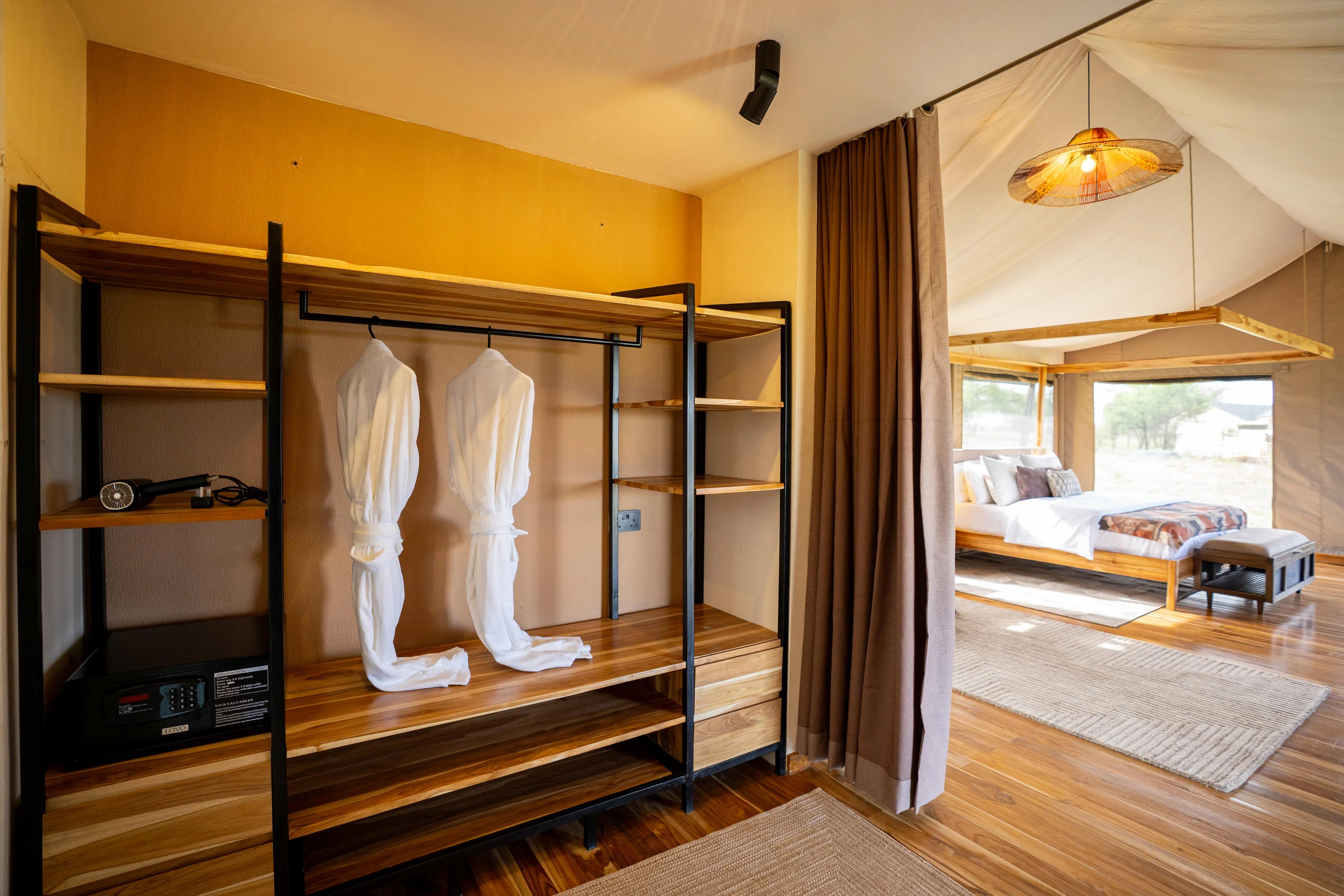 A tent dressing area with dressing gowns