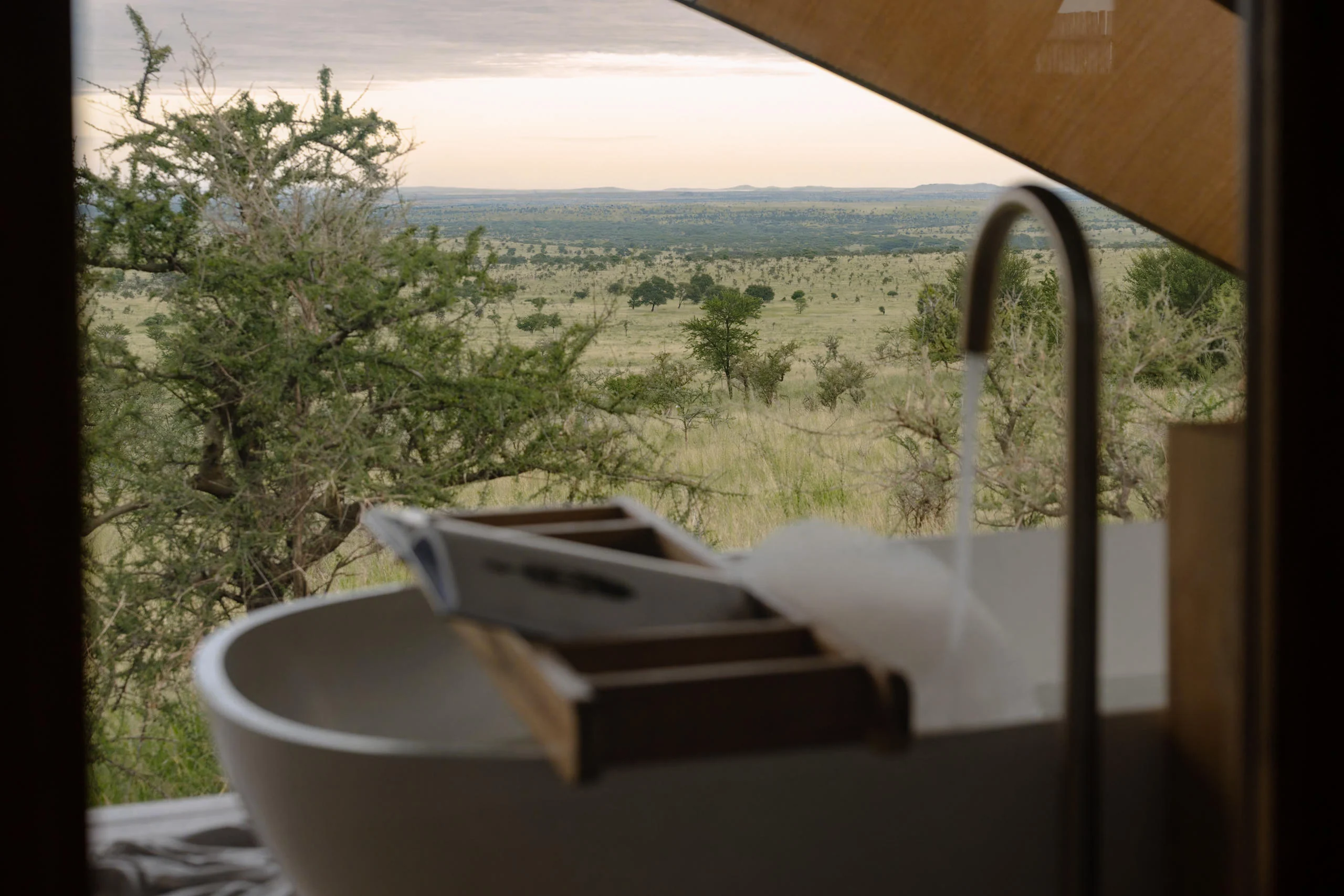 A bath beside a window onto the plains