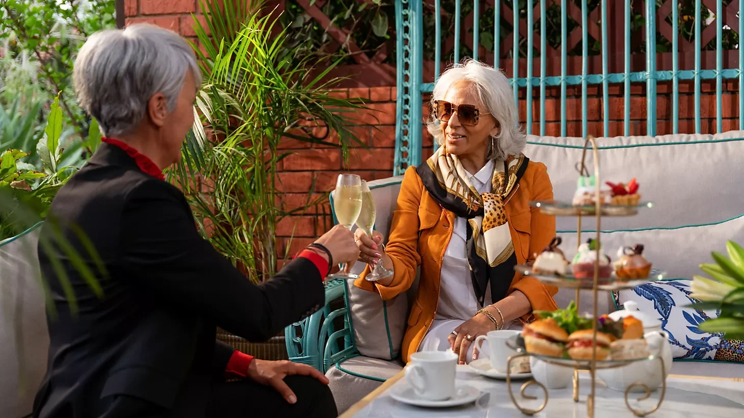 Two guests at afternoon tea on the terrace