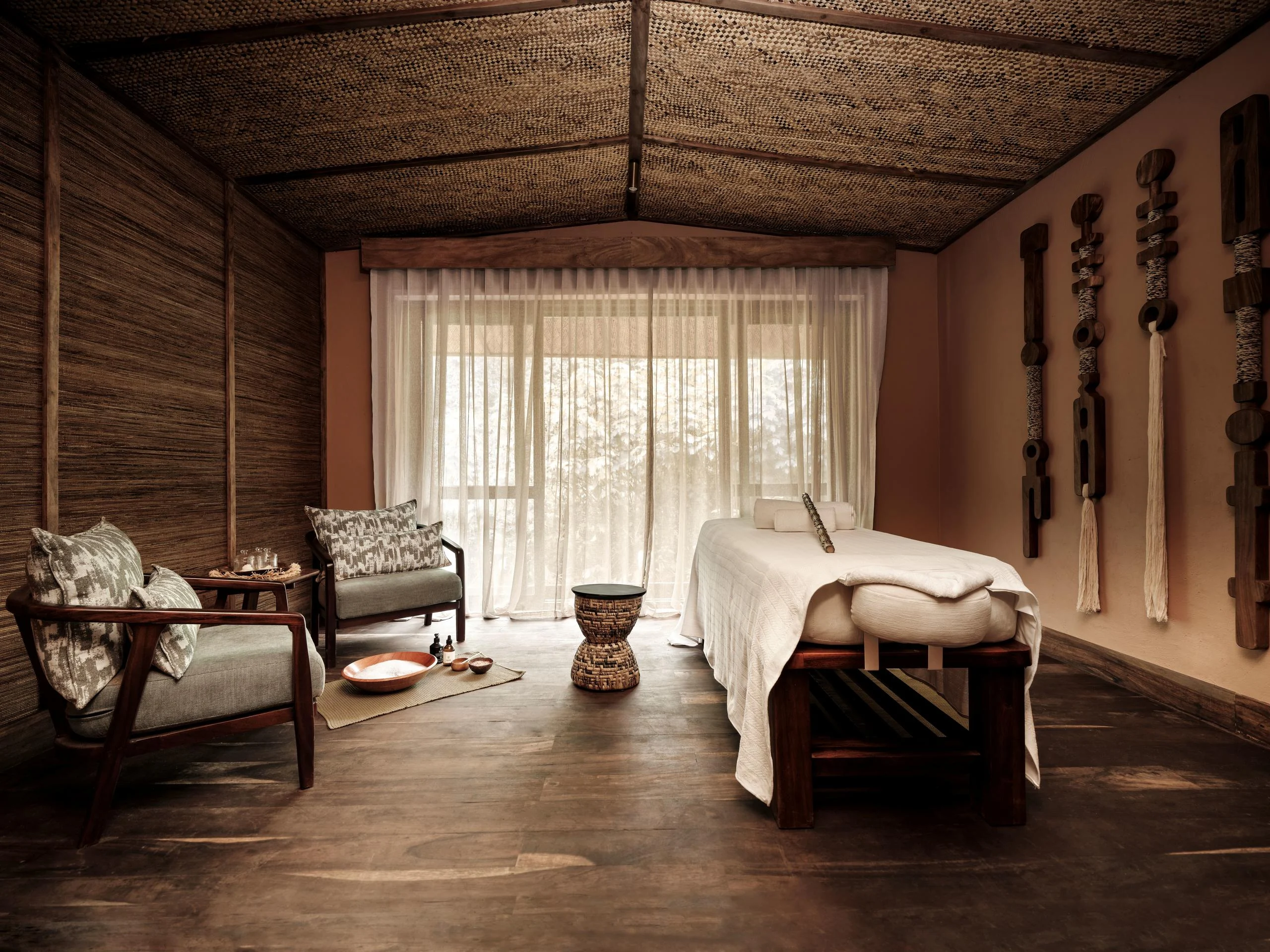 The spa treatment room with the forest beyond