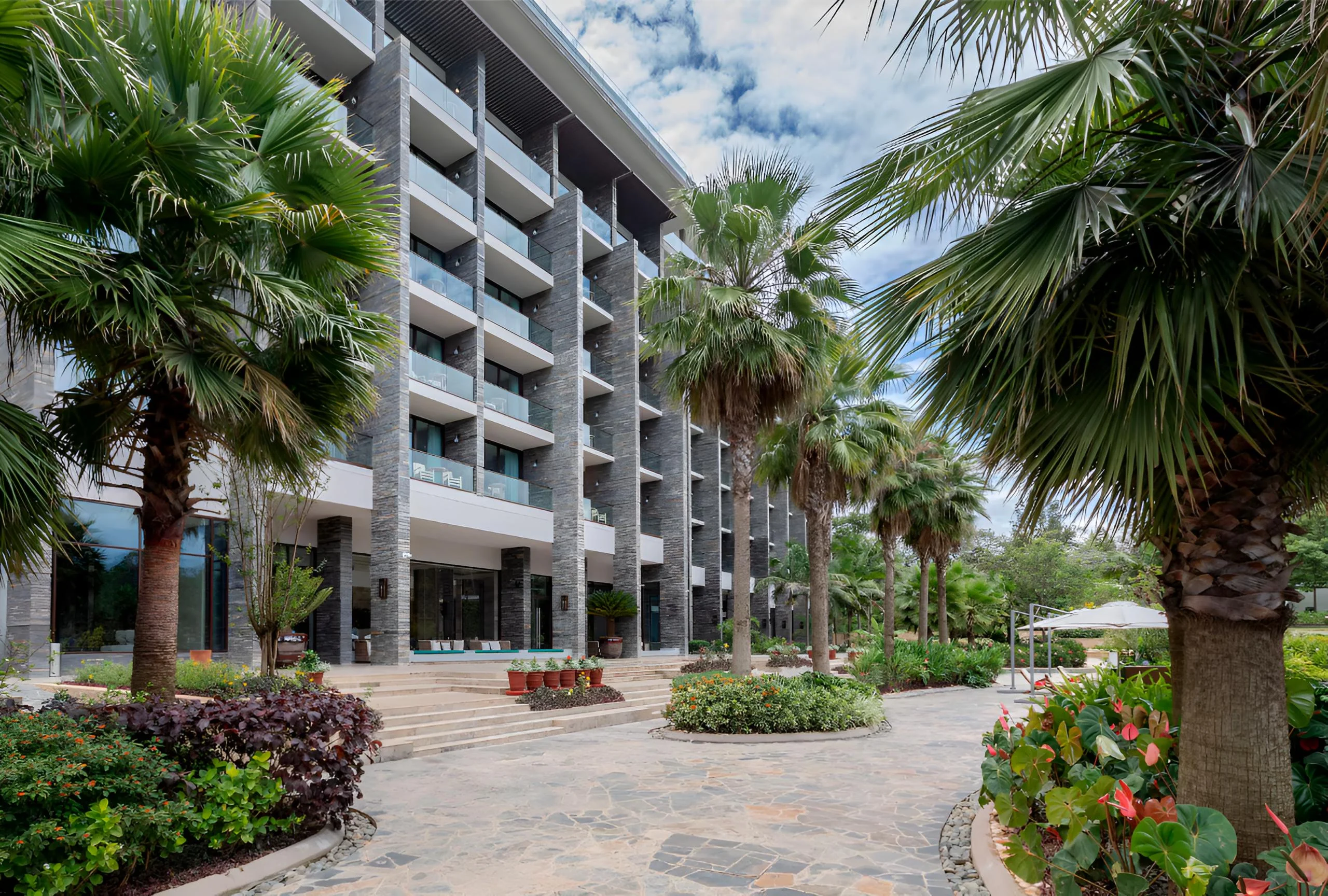 The hotel among palms and gardens