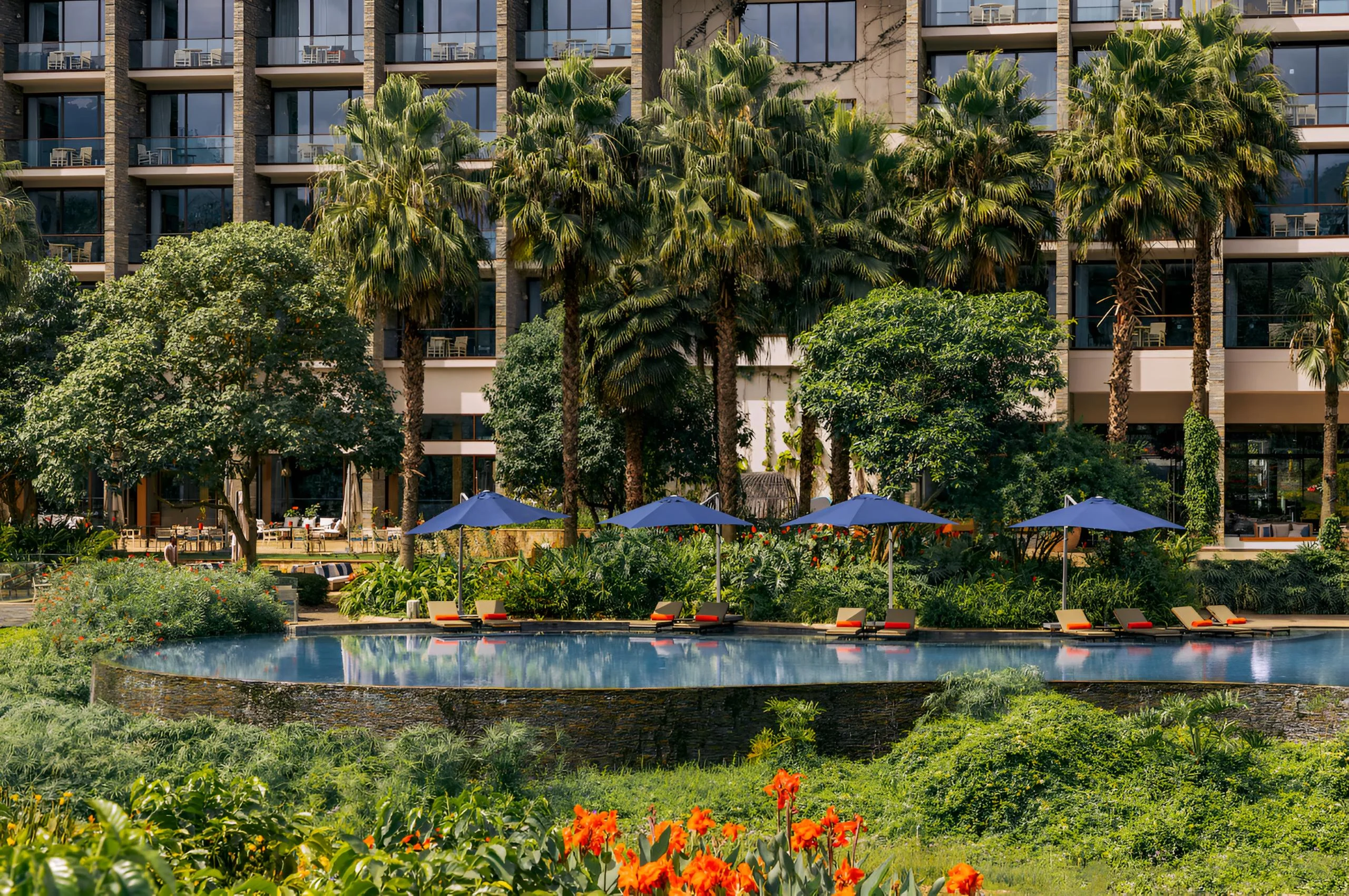 The pool and gardens in front of the hotel