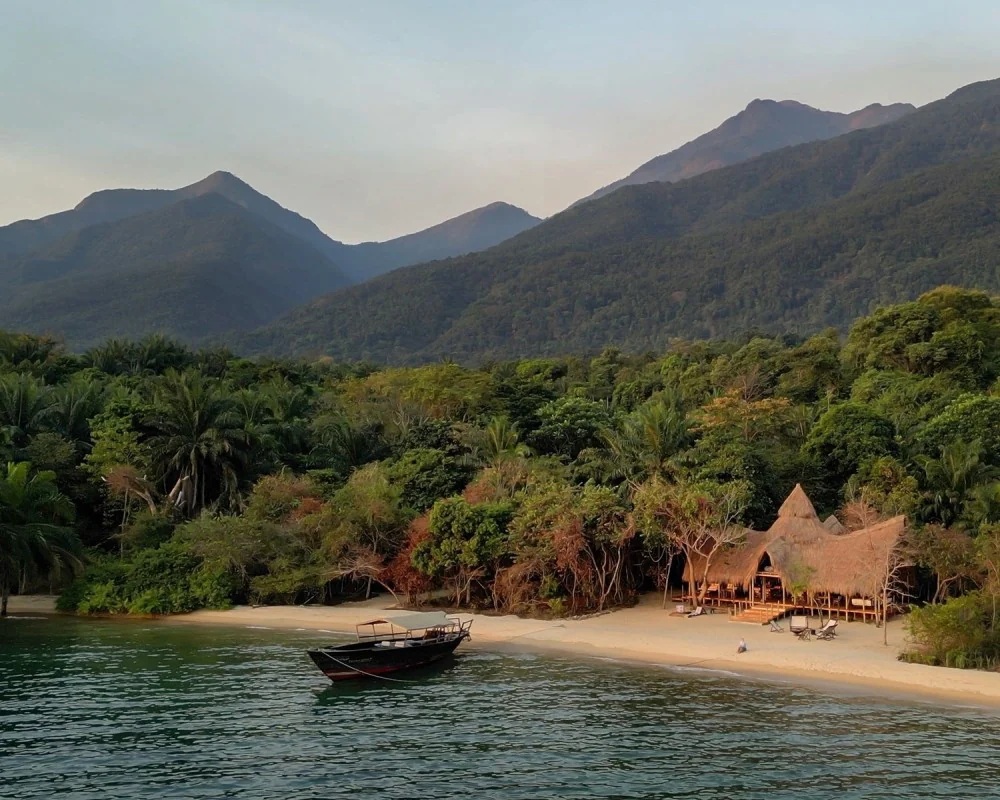 The camp on the lakeshore beach beneath the Mahale Mountains