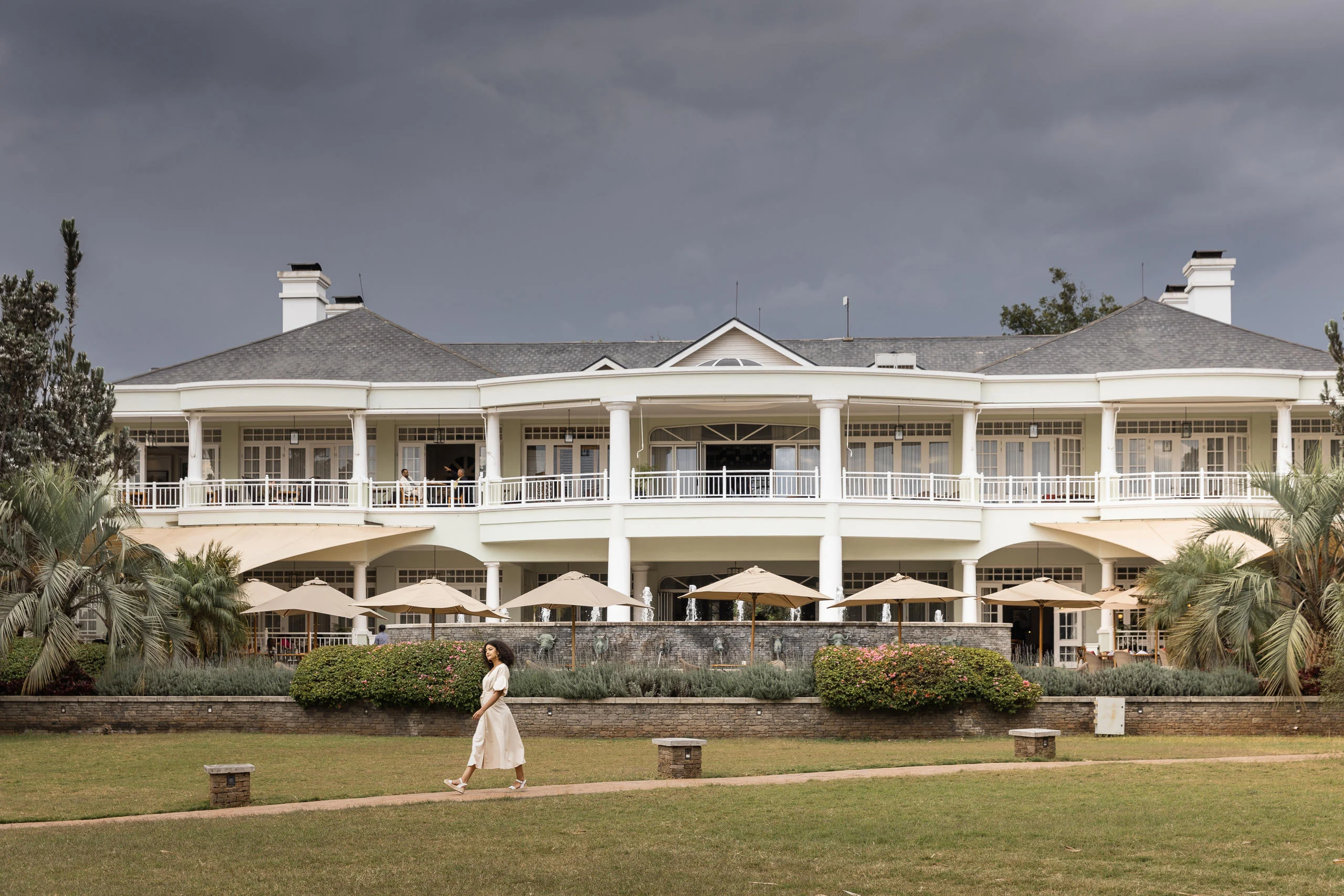 The hotel's colonnaded facade seen across the lawn