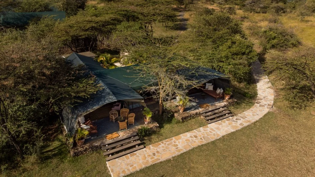 The camp's tents beside the river, from the air