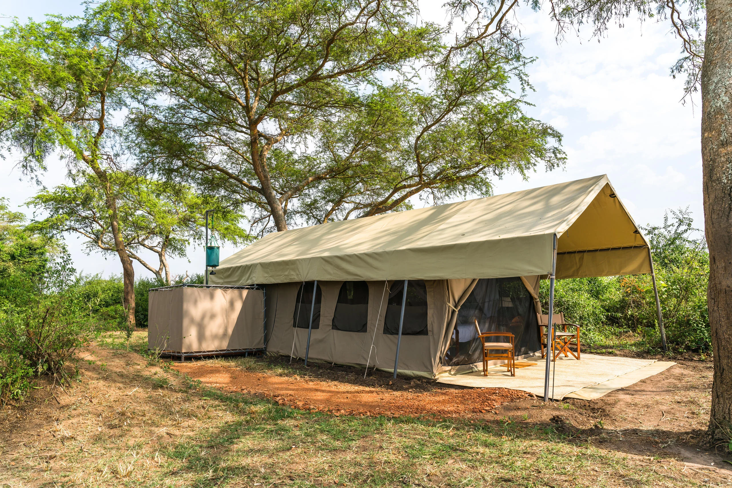 A guest tent beneath the trees