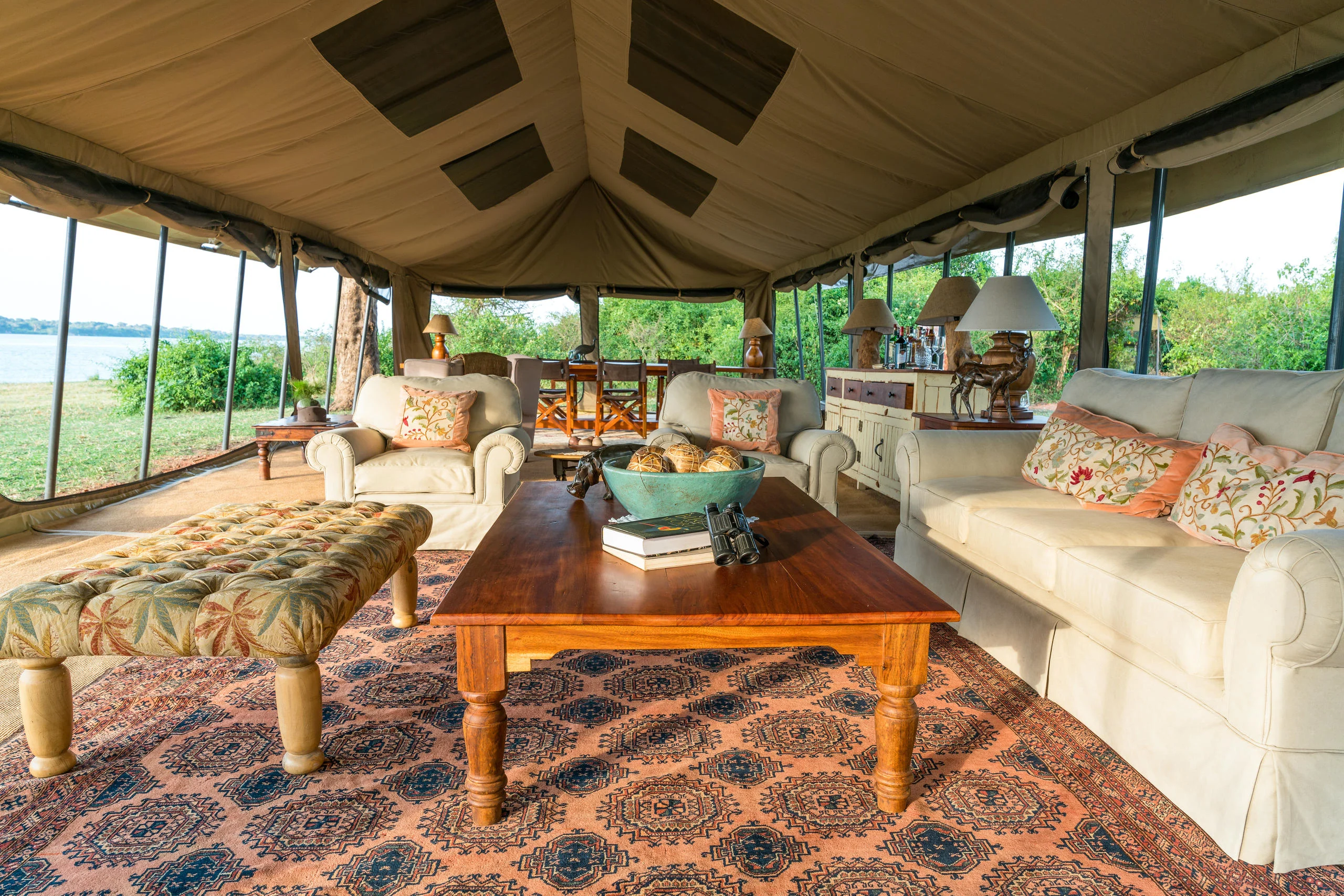 The lounge tent with sofas and a patterned rug