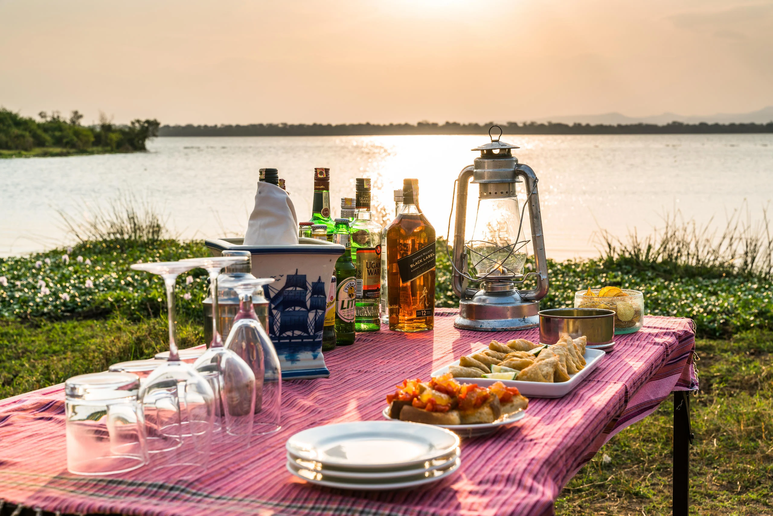 Sundowners laid out beside the lake