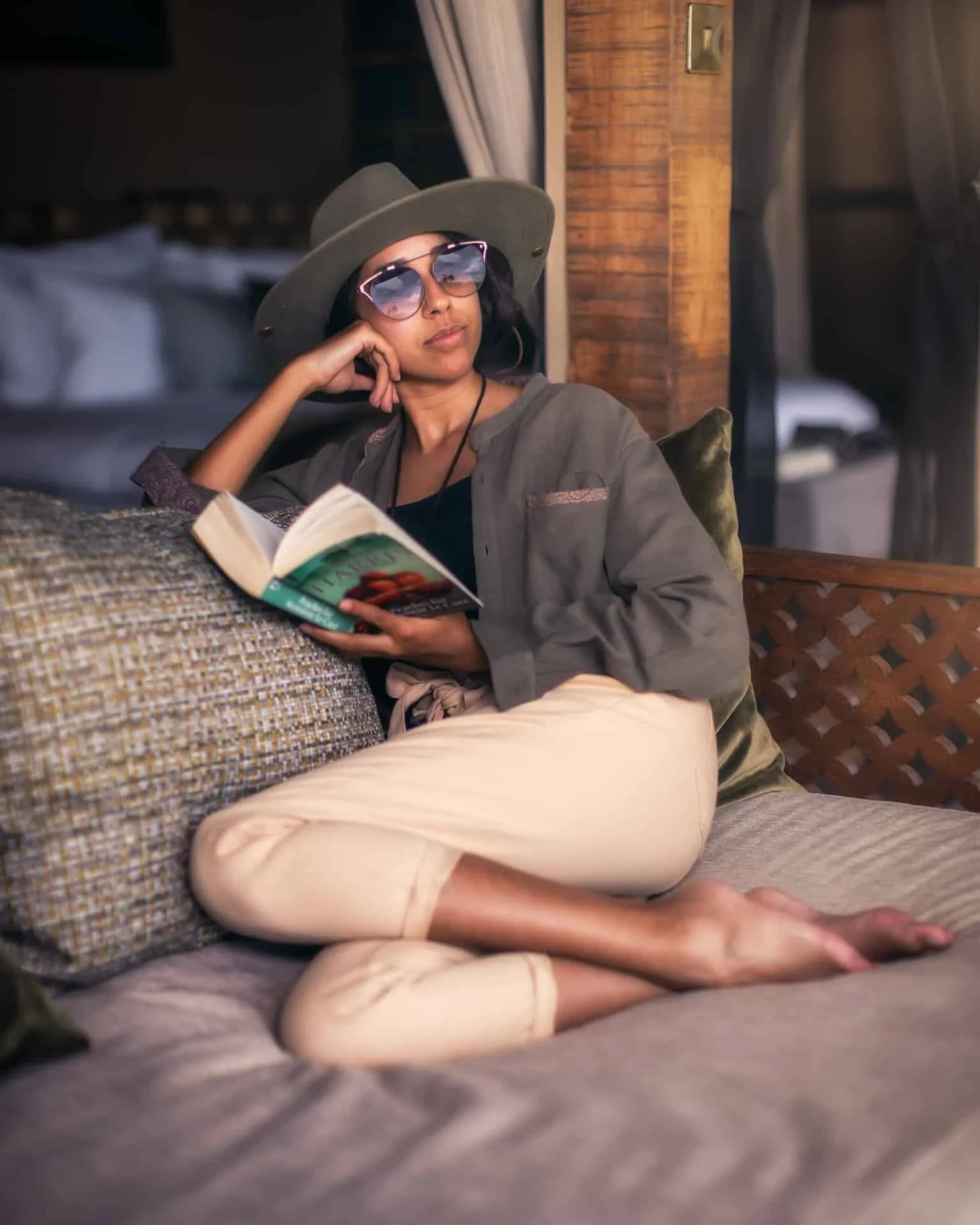 A guest reading on a daybed