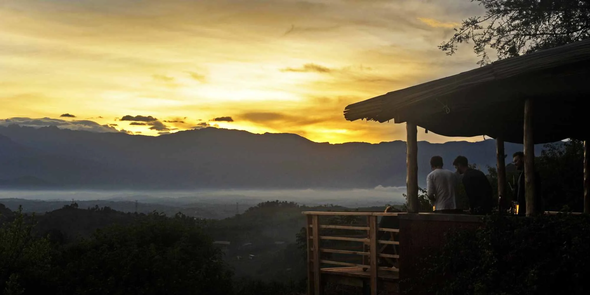 The veranda at sunset with the Rwenzori foothills beyond