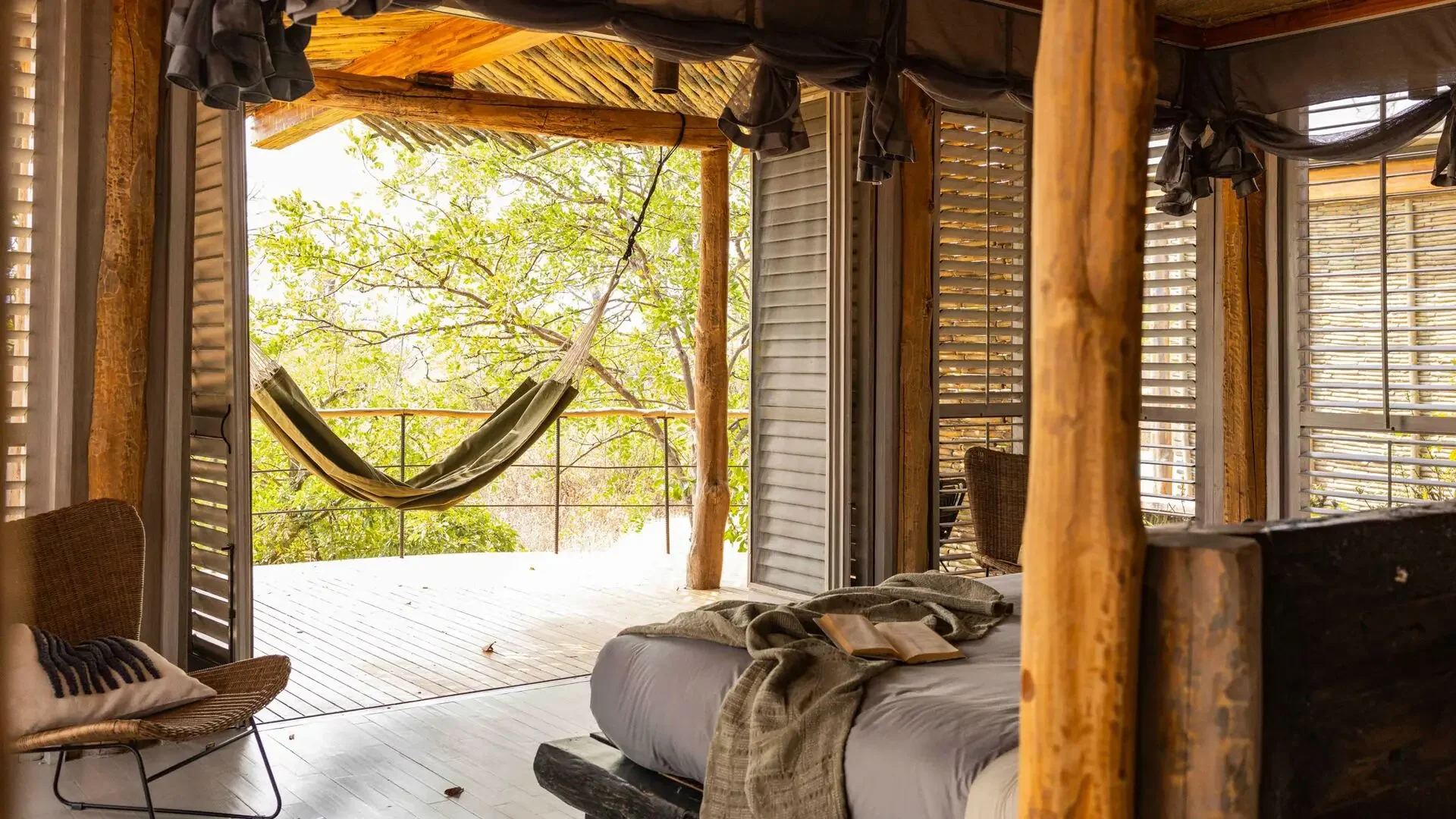 Looking from a bedroom to a hammock on the deck