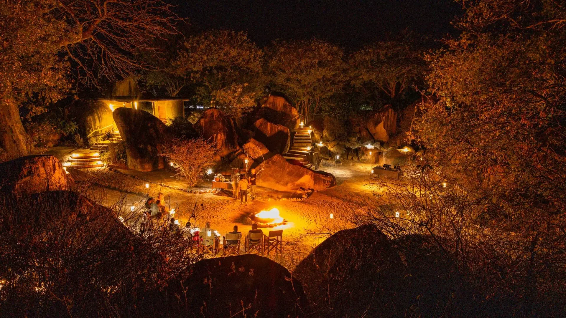 The lodge on its rocky ridge, lit at night