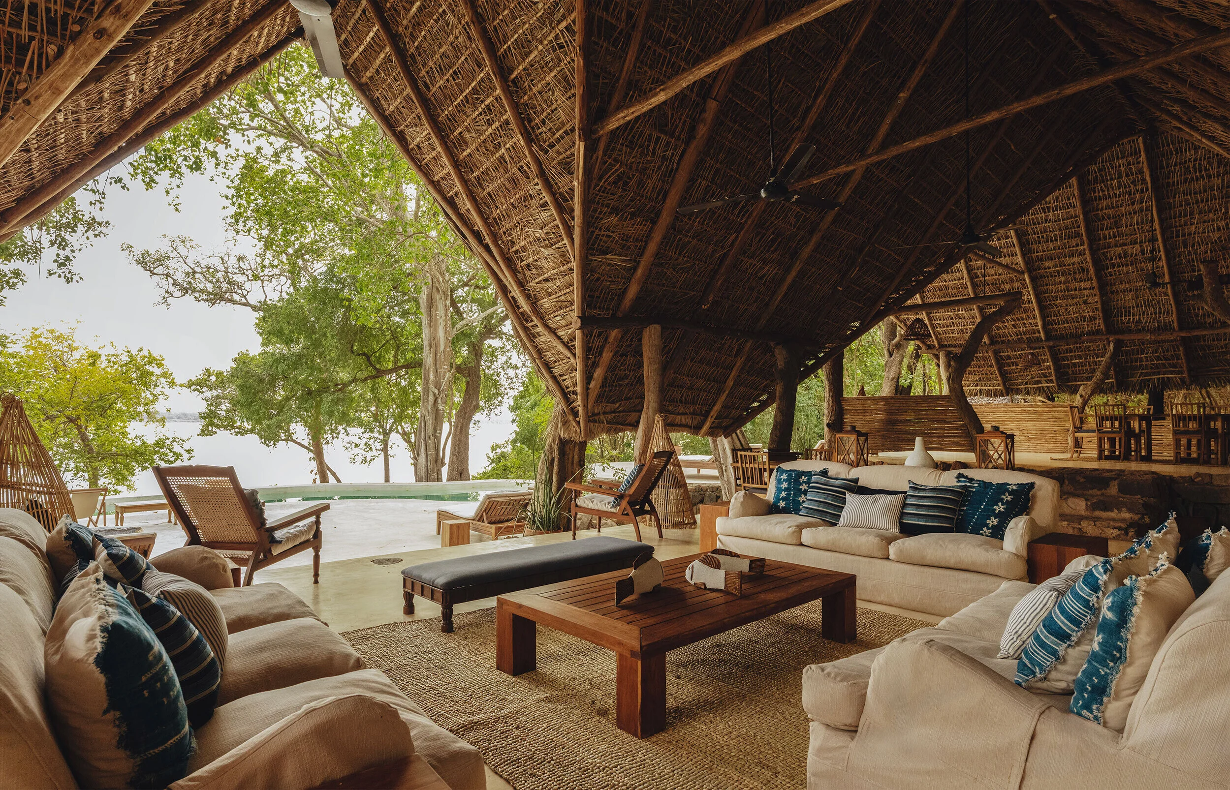 The open-sided lounge under a high thatched roof