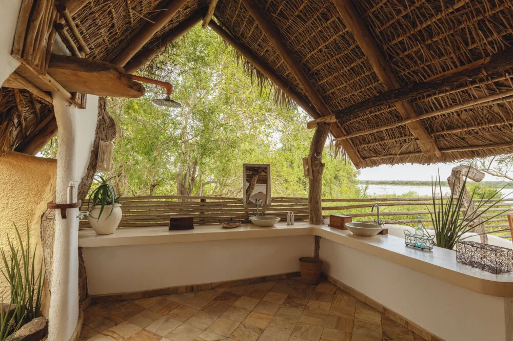 A bathroom basin looking out over the river