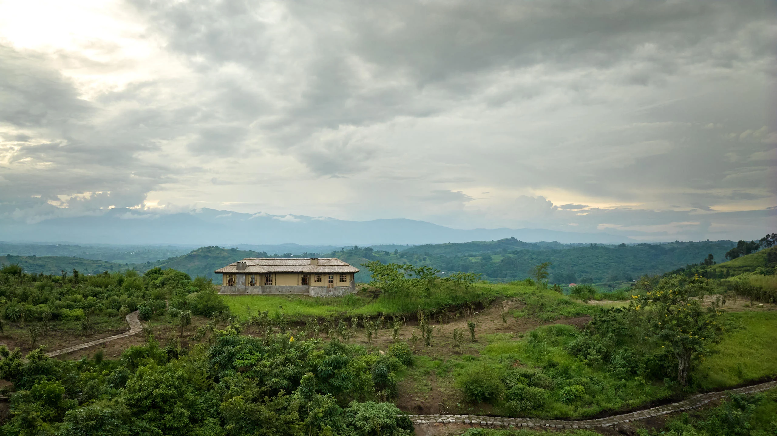 The main building on the ridge under a stormy sky