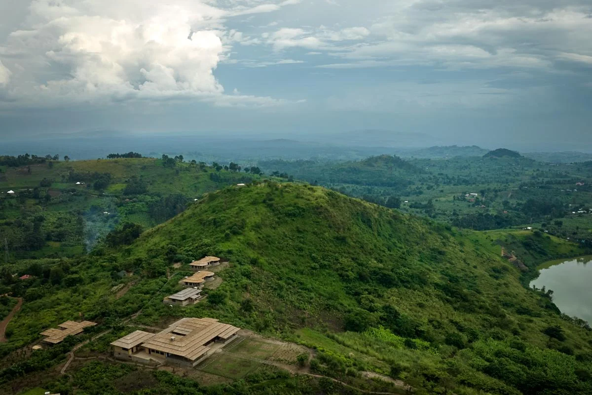 The cottages on the hilltop with the crater lakes beyond, from the air