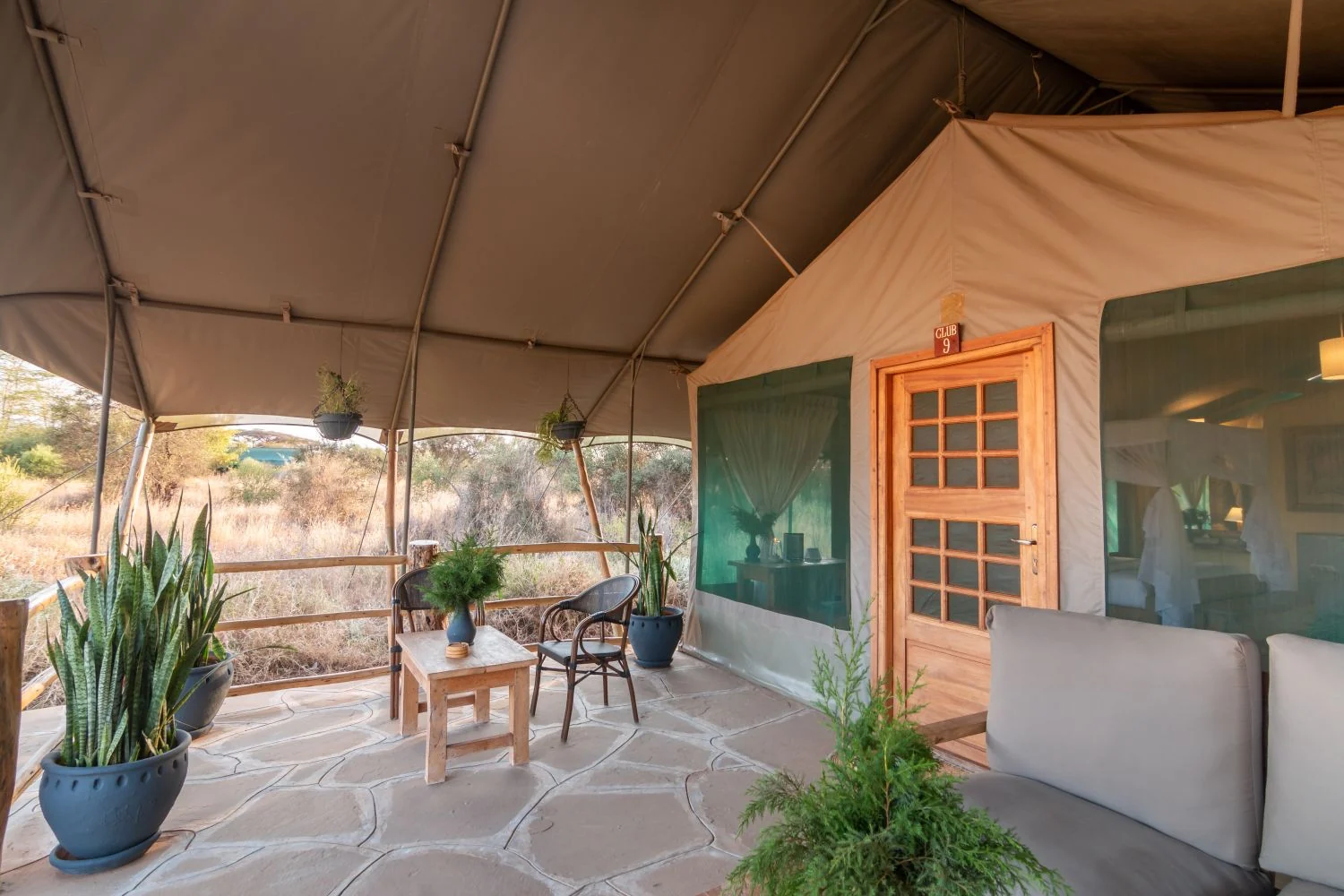 A tent veranda with chairs