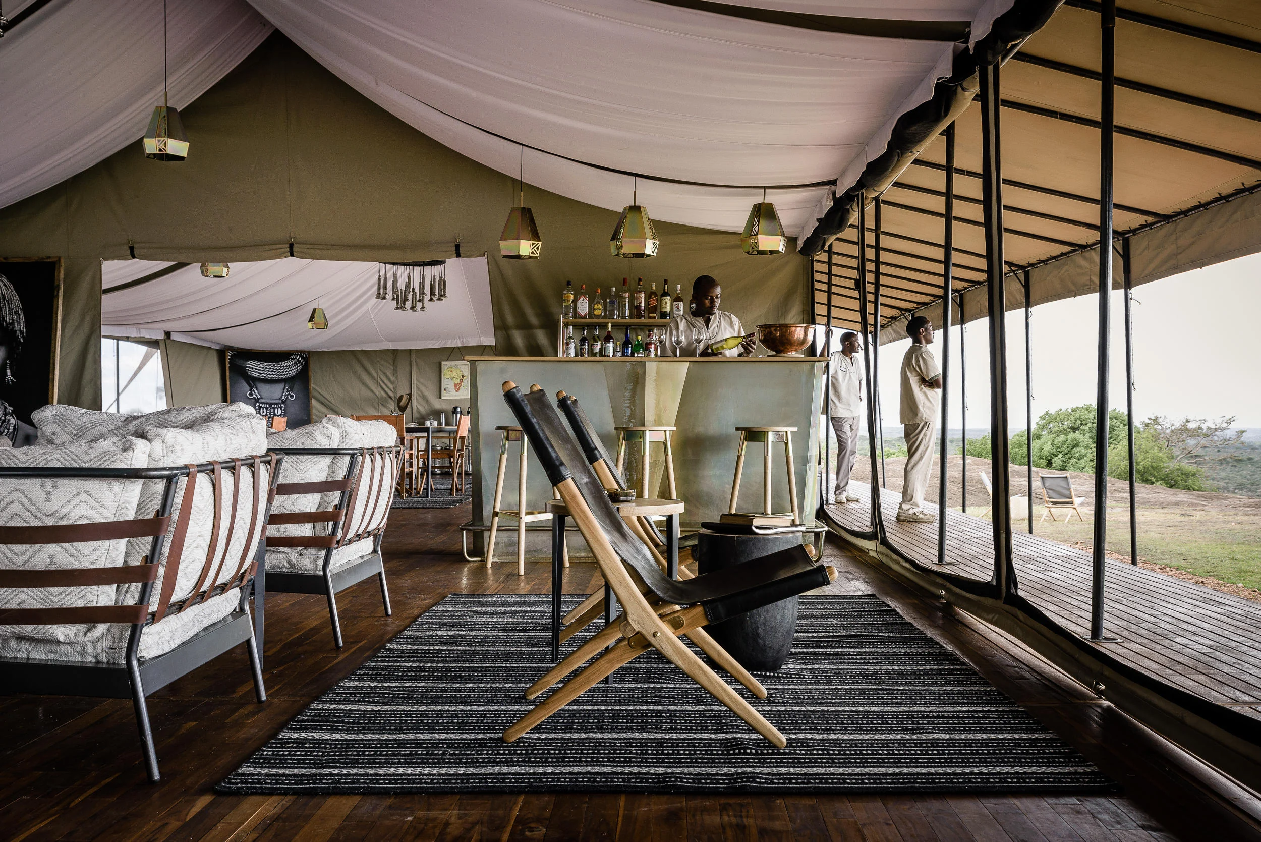 The lounge tent with a rug and the plains beyond