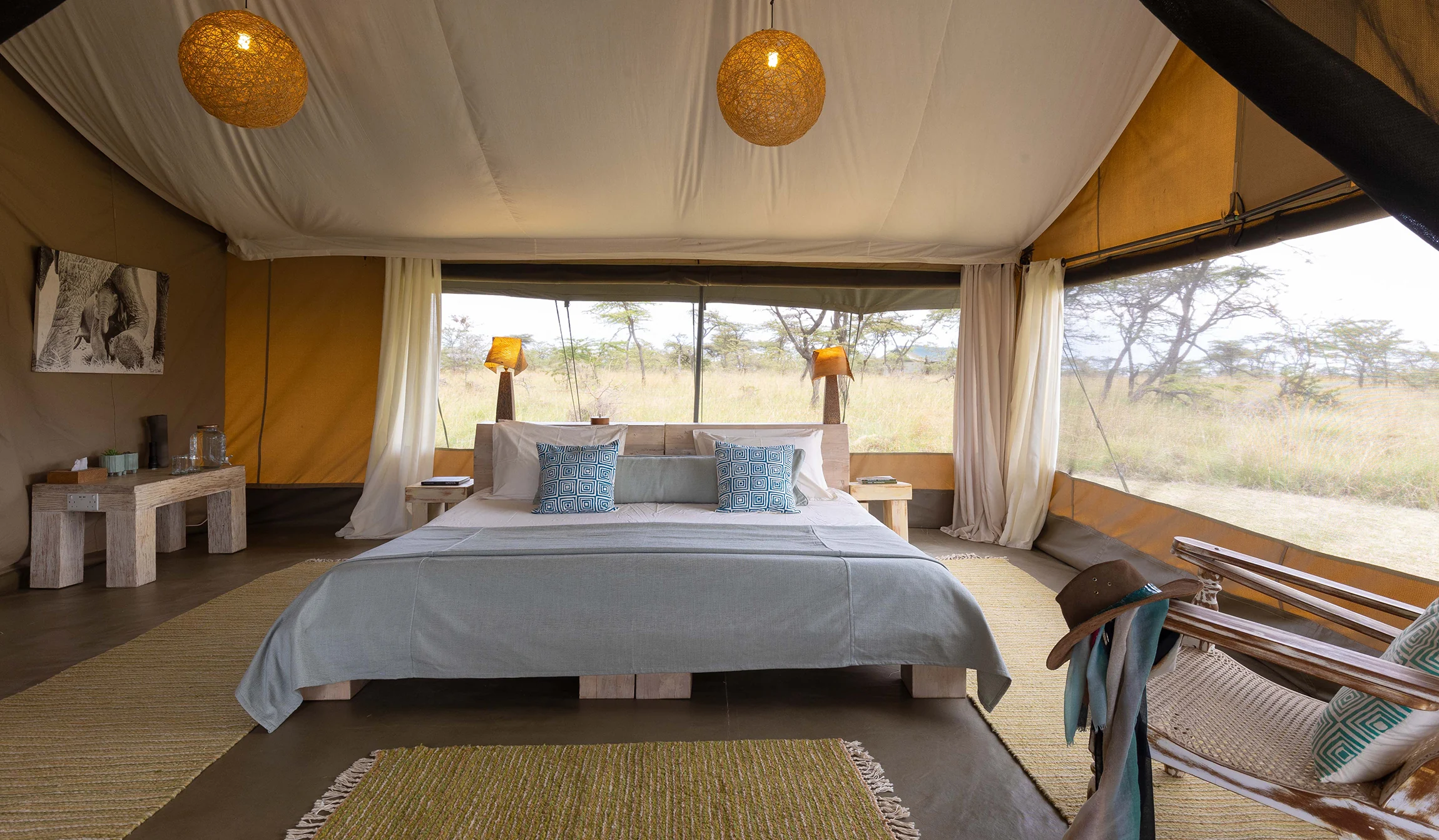 A tent interior looking out to the plains