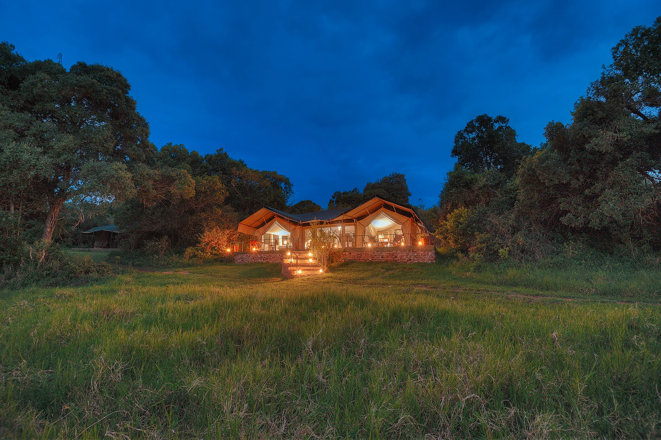 The family tent lit at dusk